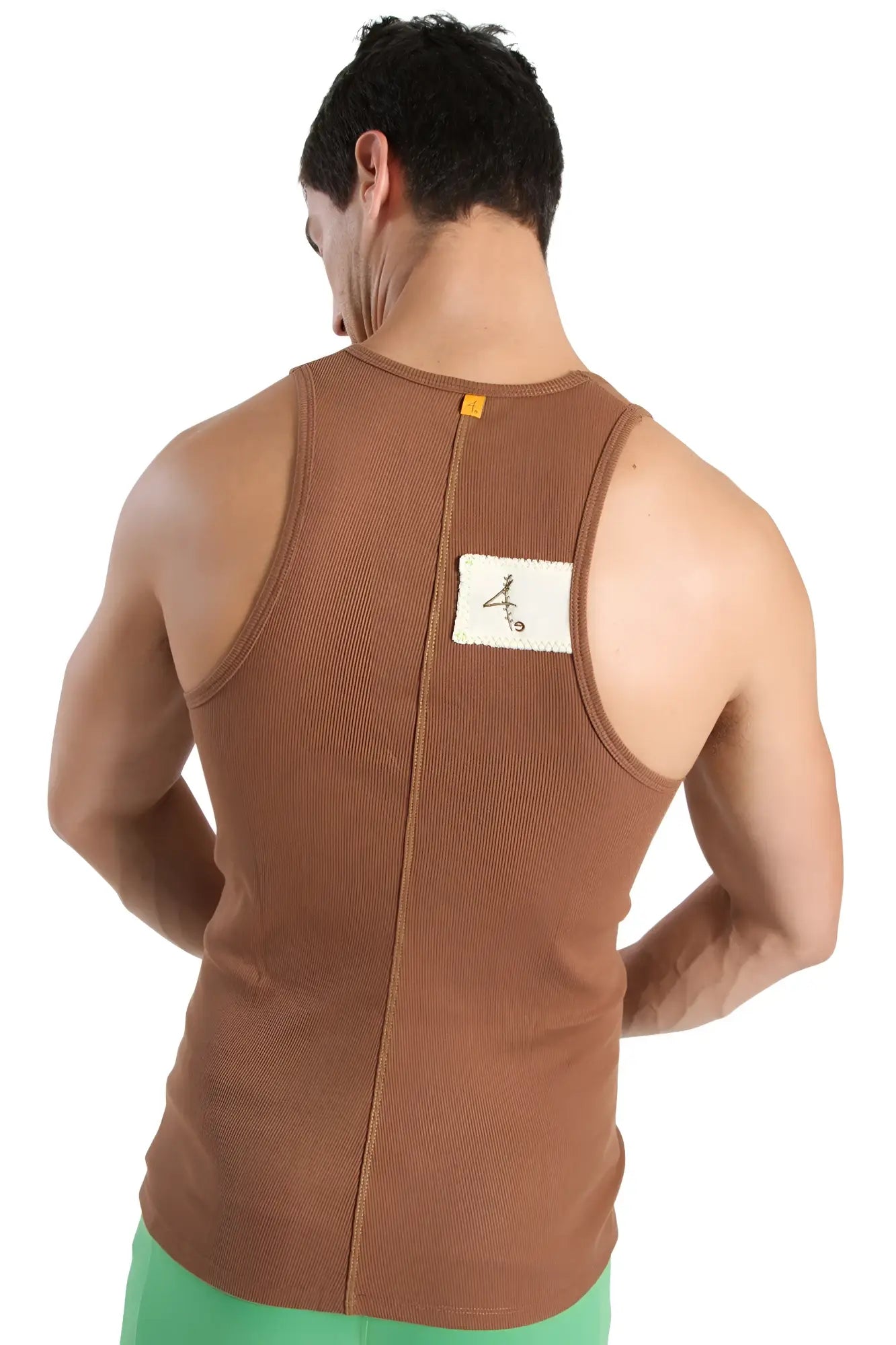 Back view of brown ribbed edge sustain tank top with white label showcasing sustainable fabric and fit