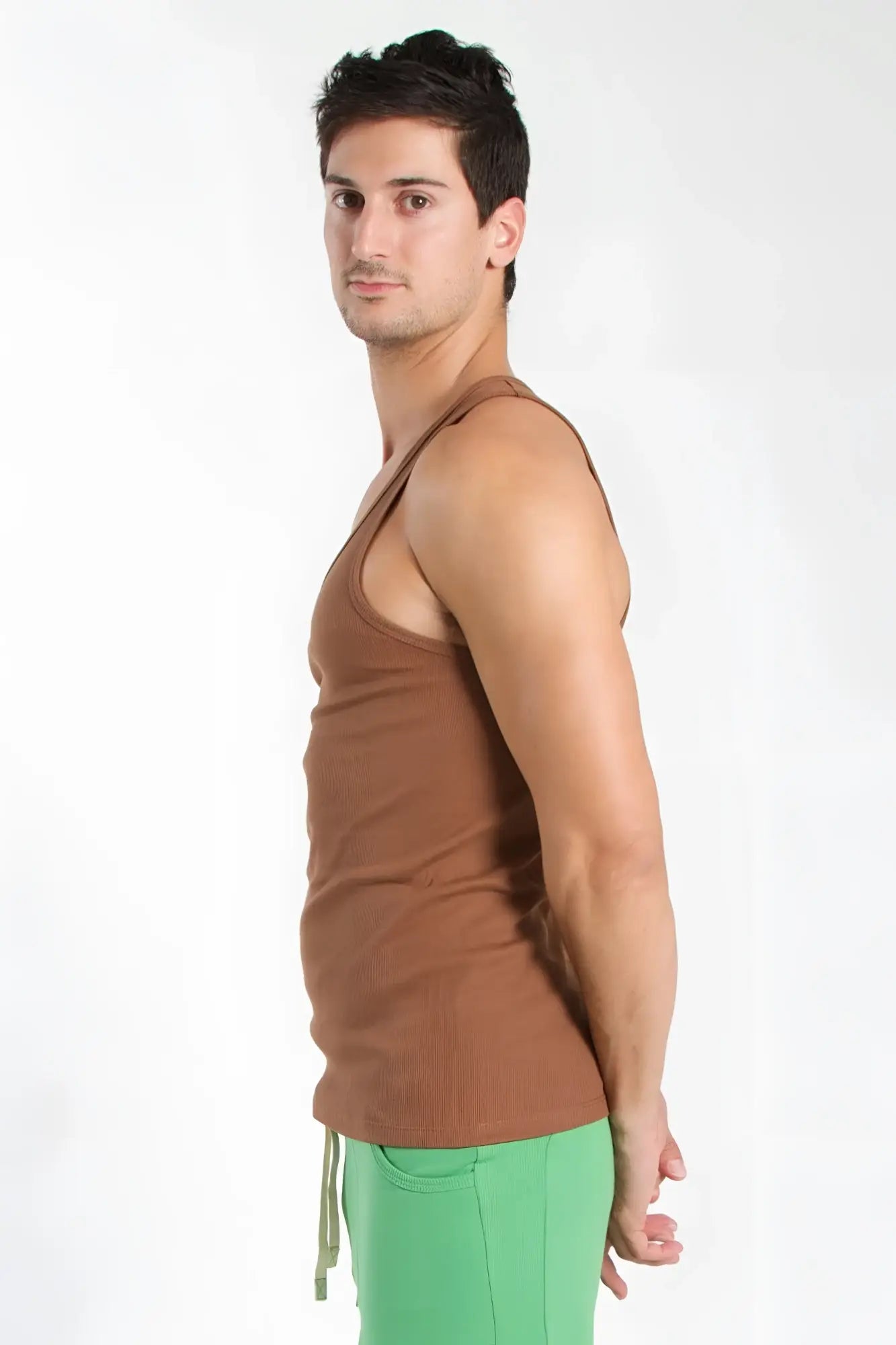 Brown sleeveless edge sustain tank top in chocolate with a simple fitted design for casual wear