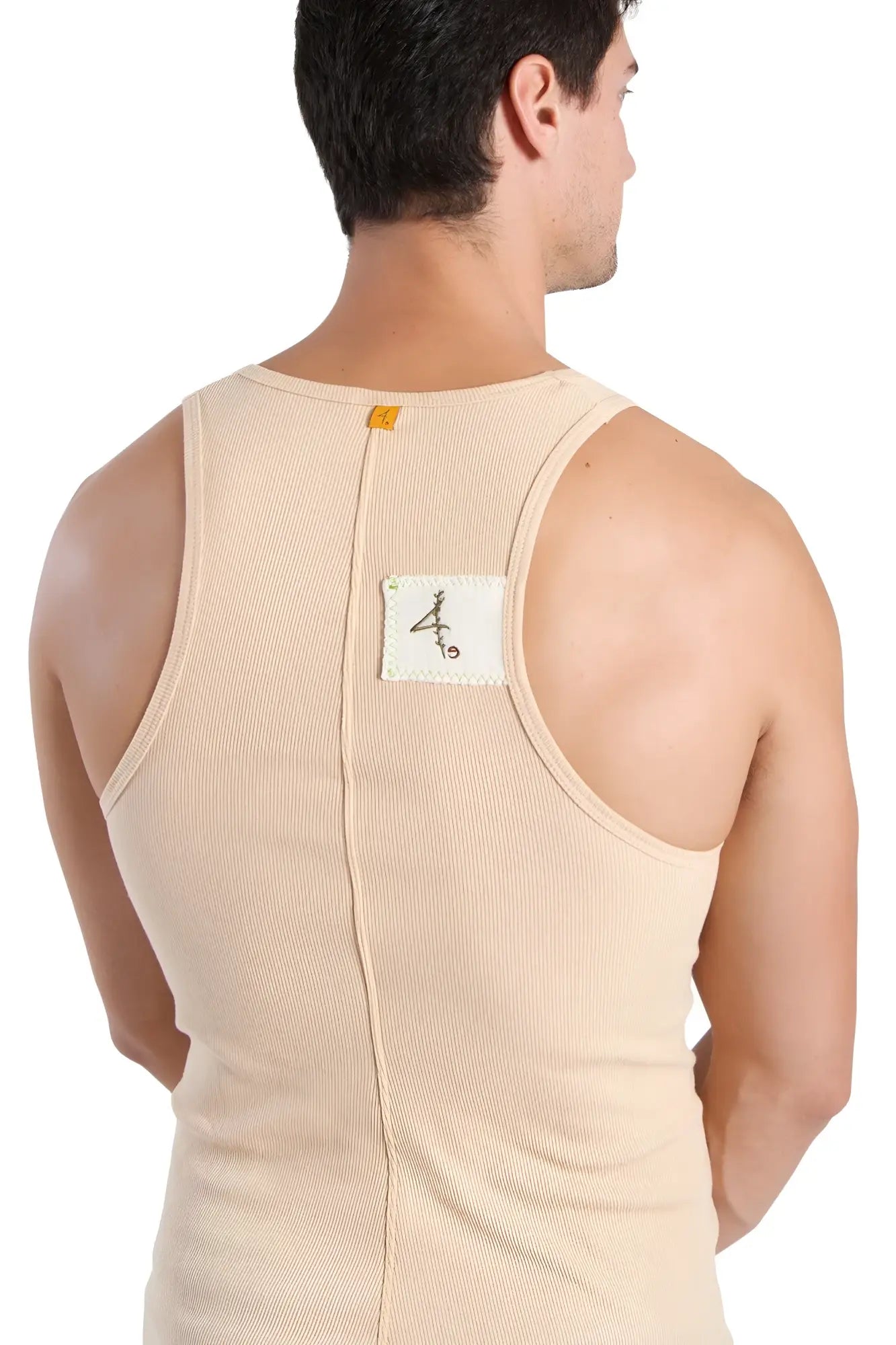 Beige ribbed cotton edge sustain tank top back with central zipper and white label featuring black calligraphy
