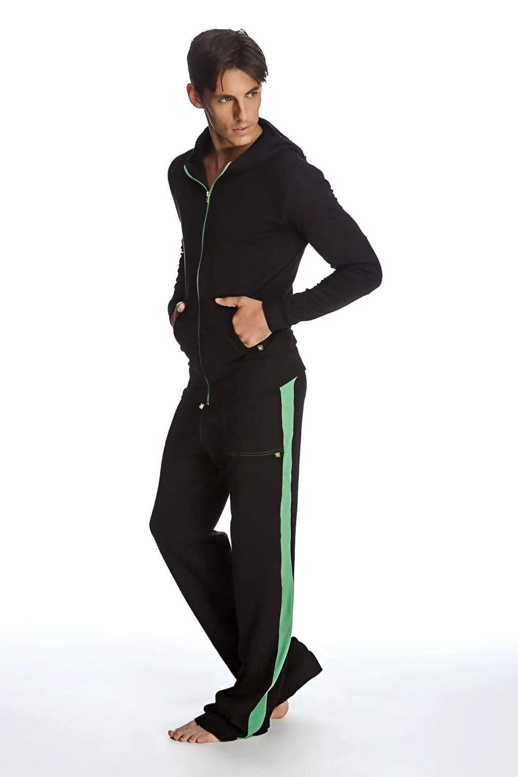 Form-fit crossover yoga track performance black hoodie and pants set with vibrant green stripe for activewear use