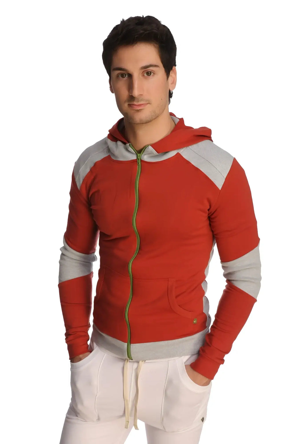Form-fit crossover yoga track performance hoodie in cinnabar grey with red and gray panels green zipper pull and pockets
