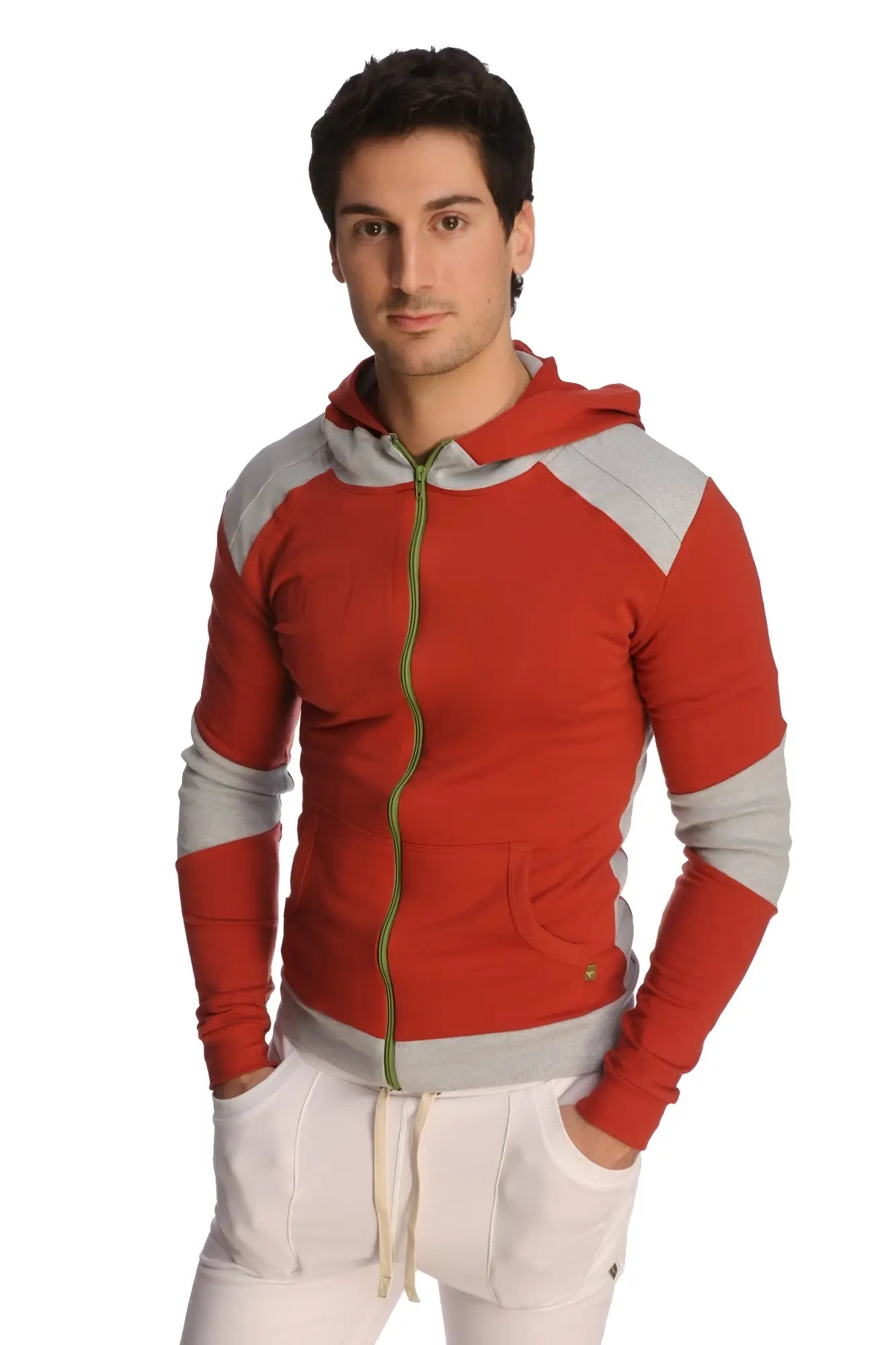 Form-fit crossover yoga track performance hoodie in cinnabar grey with red and gray panels green zipper pull and pockets