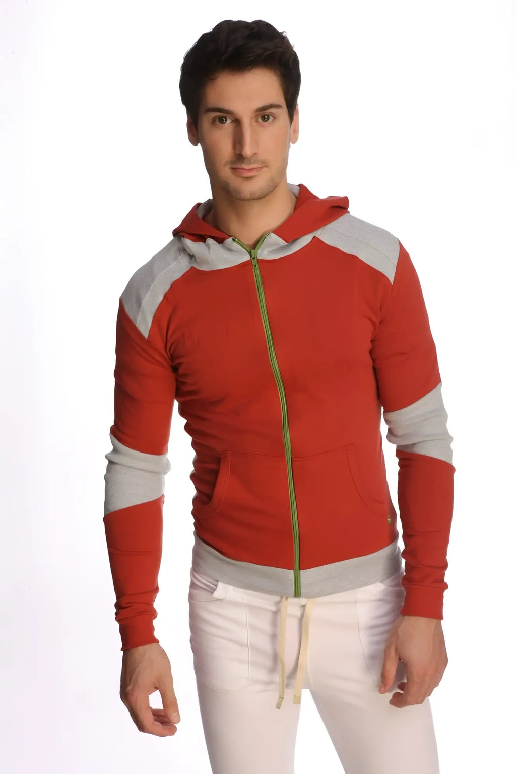Form-fit crossover yoga track performance hoodie in cinnabar grey with red and gray fabric and green zipper