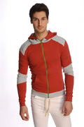 Form-fit crossover yoga track performance hoodie in cinnabar grey with red and gray fabric and green zipper