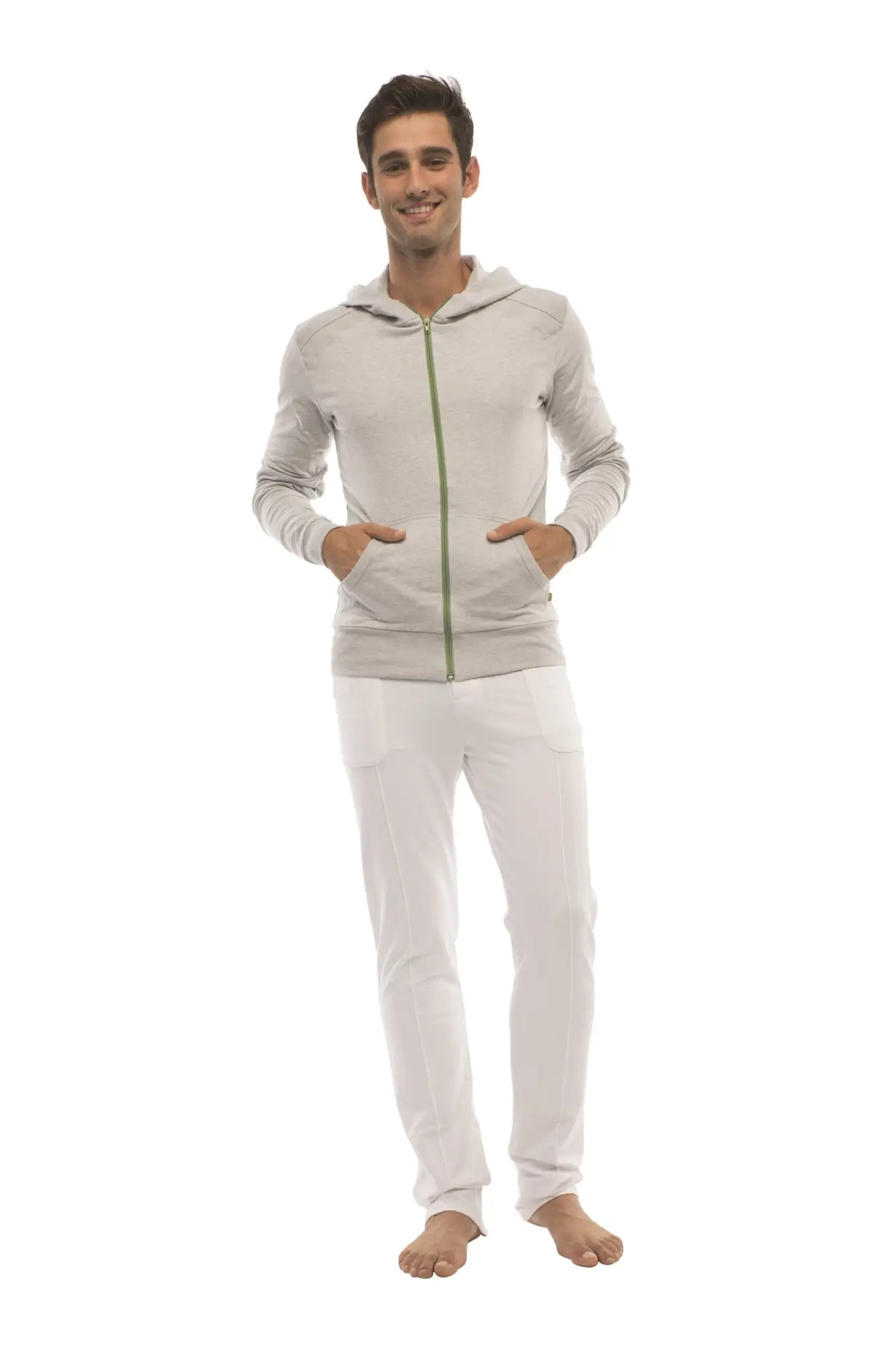Form-fit crossover yoga track performance hoodie in heather gray with green zipper and hood worn by model