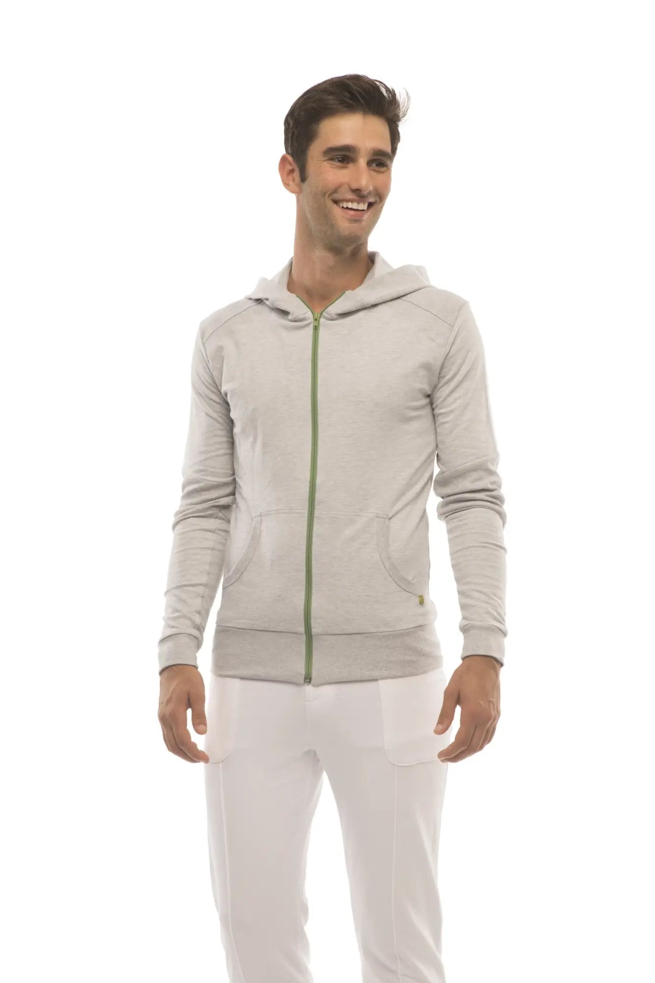 Form-fit crossover yoga track performance hoodie in heather gray with subtle textured fabric and green zipper
