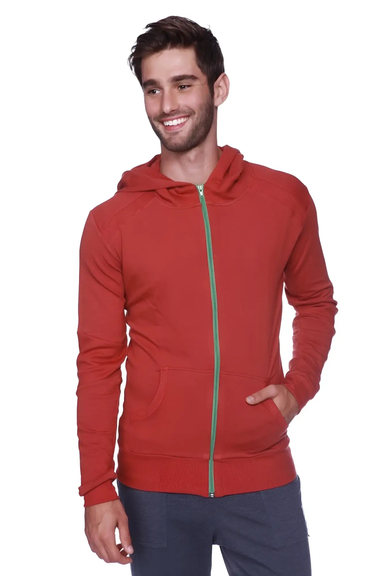 Form-fit crossover yoga track performance hoodie in solid cinnabar red with green zipper and front pockets for activewear
