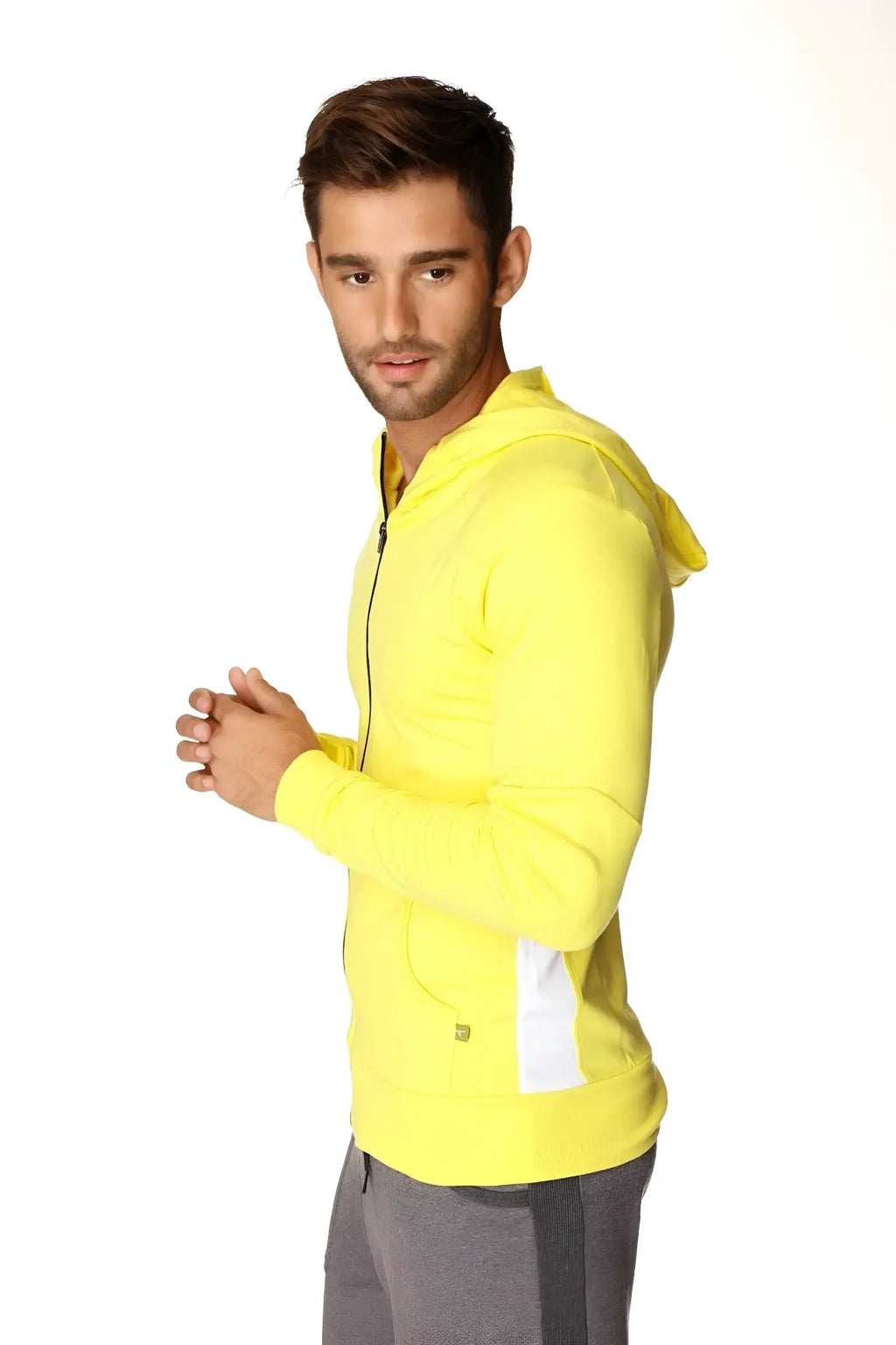 Form-fit crossover yoga track performance hoodie in tropic yellow with white side panels and matching hood