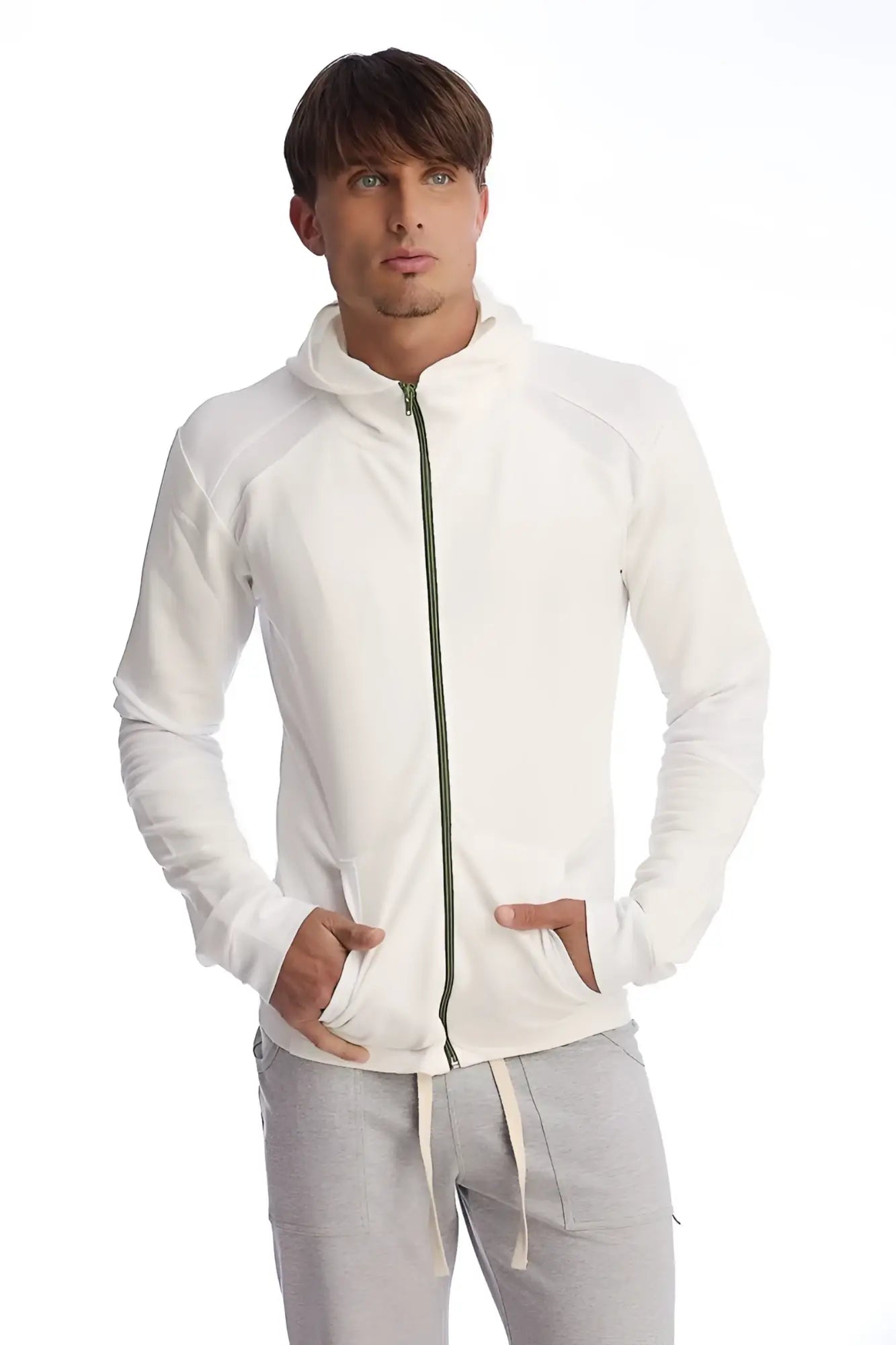 Form-fit crossover yoga track performance hoodie in white with subtle green zipper and ribbed cuffs for comfort