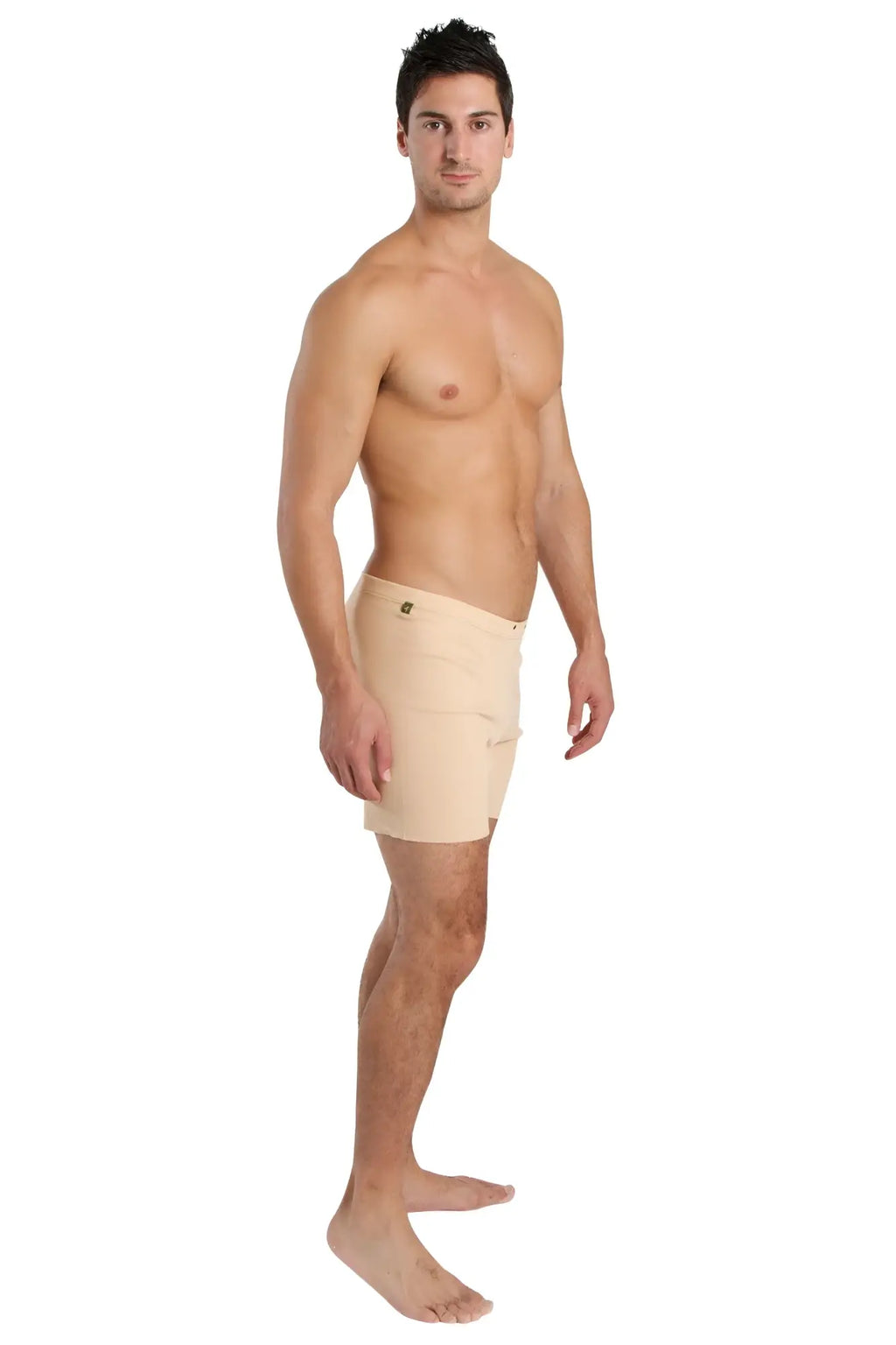 Beige fusion yoga short featuring a subtle side seam and small button closure at the waistband for athletic use