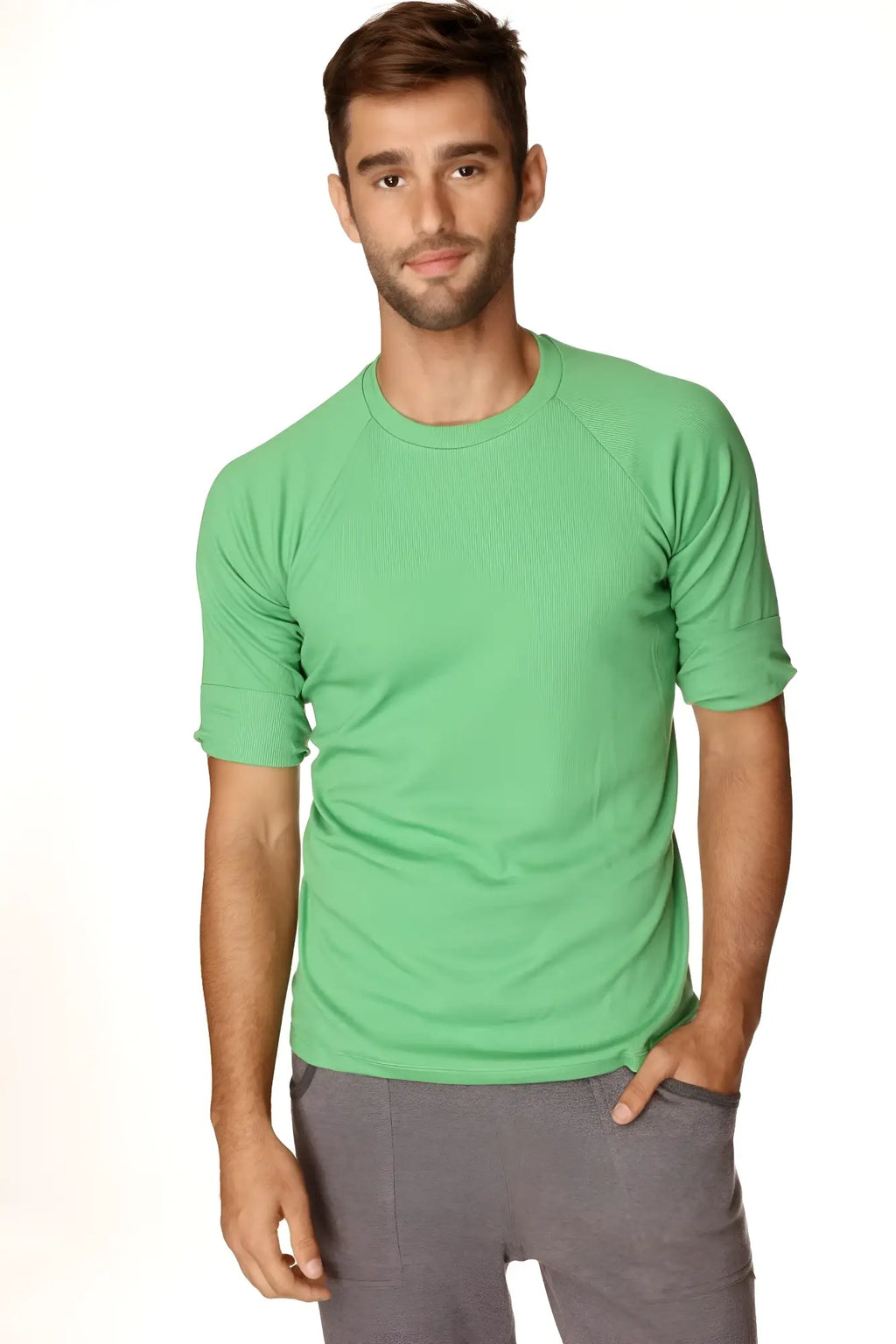 A men’s short-sleeved hybrid crew neck raglan tee in bamboo green with ribbed texture and rolled-up sleeves