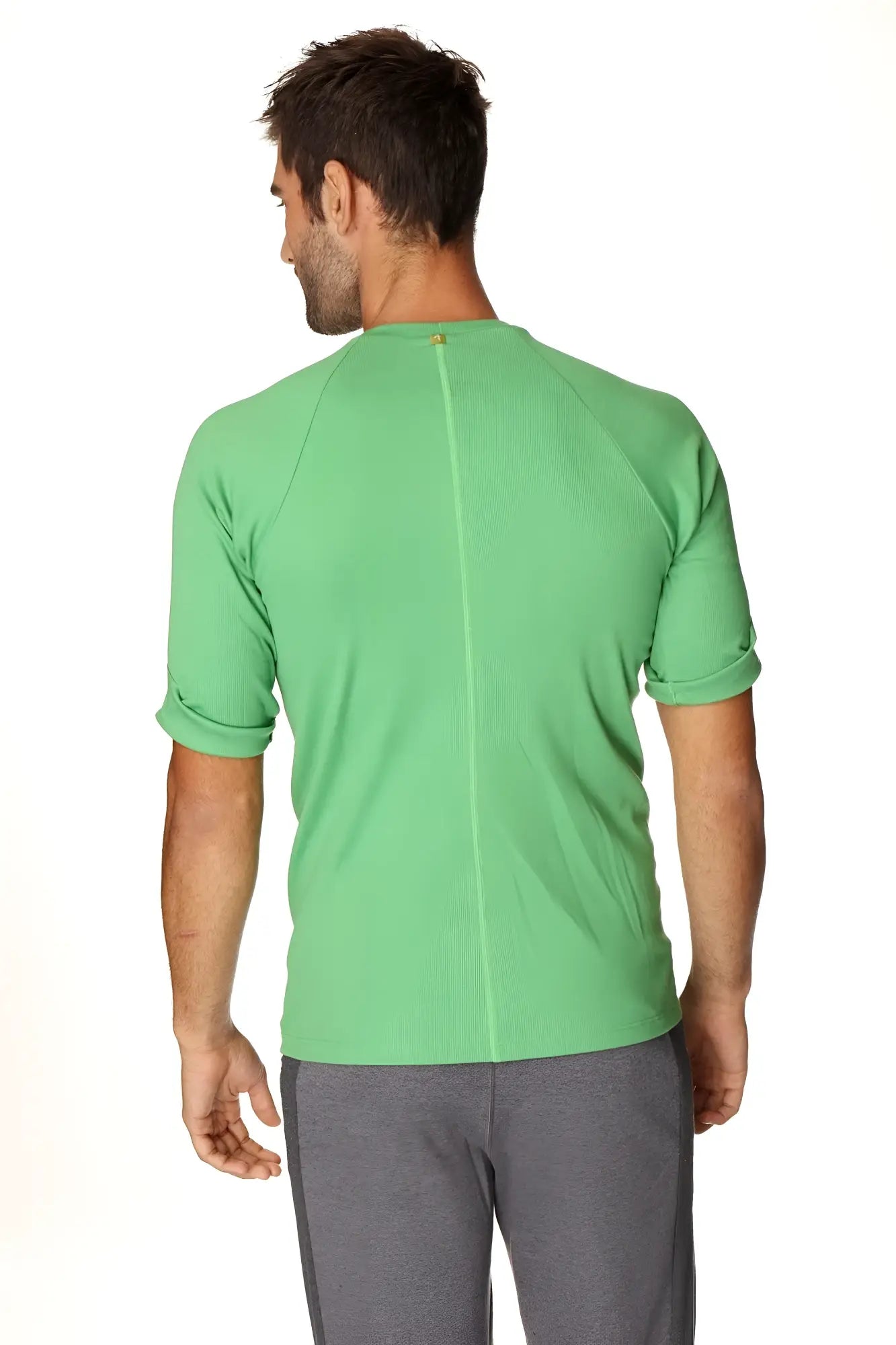 Hybrid crew neck raglan tee in bamboo green featuring a vibrant green short-sleeved athletic shirt with ribbed texture