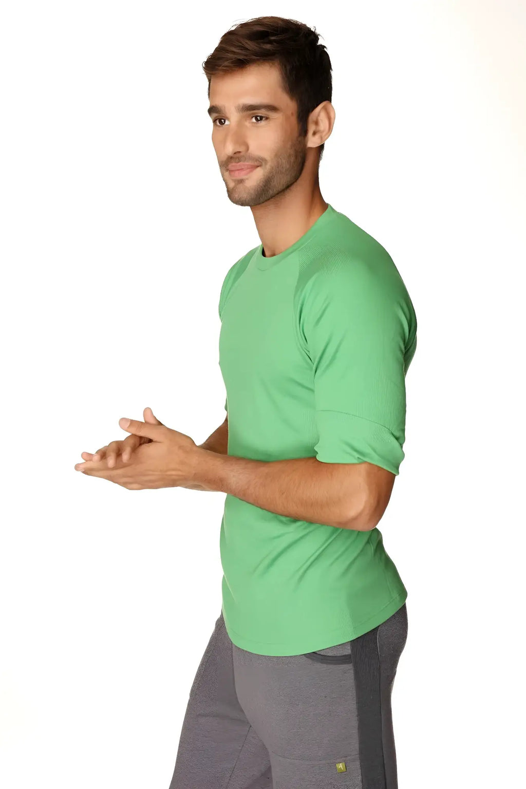 A vibrant green hybrid crew neck raglan tee made of soft cotton fabric with short sleeves