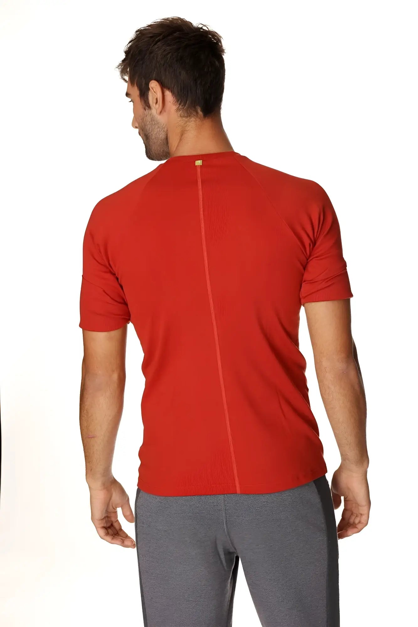 Red short-sleeved hybrid crew neck raglan tee back view with central seam in cinnabar red for athletic use