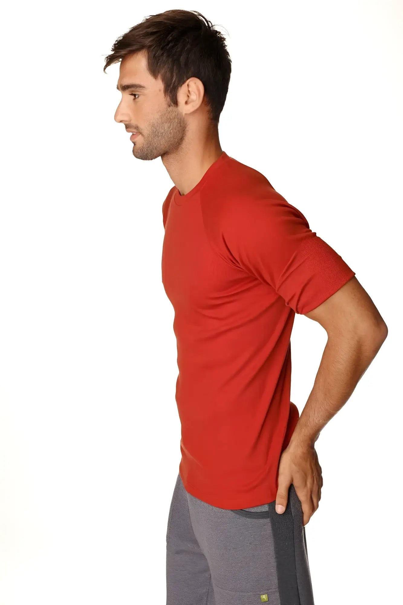 Hybrid crew neck raglan tee in cinnabar red featuring a subtle texture and short sleeves in breathable athletic fabric