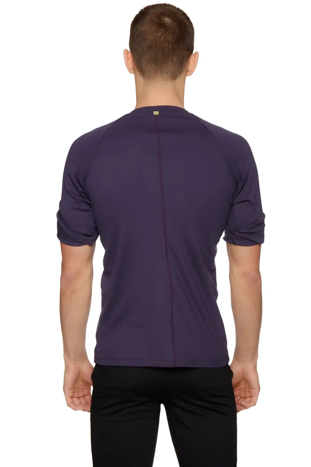 A dark purple hybrid crew neck raglan tee with short sleeves ribbed crew neck and subtle seam detailing