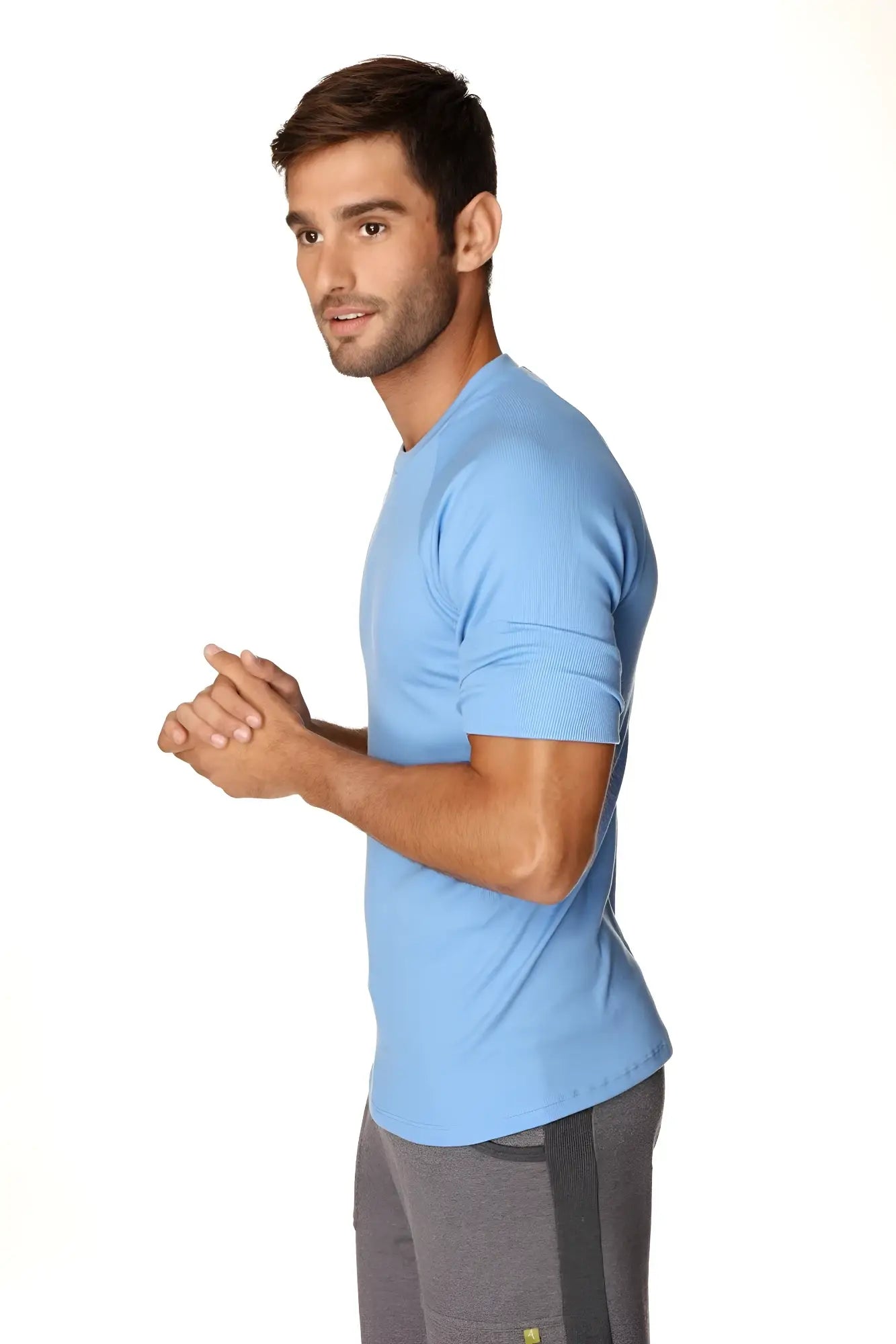 Light blue short-sleeved hybrid crew neck raglan tee made from breathable fabric for athletic use