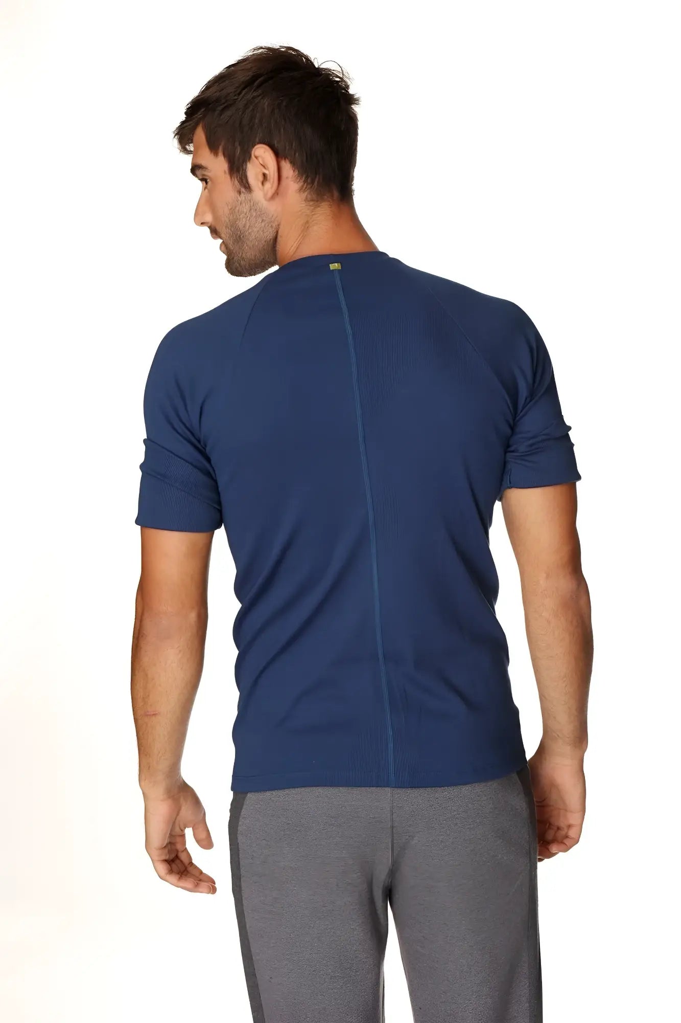 Navy blue short-sleeved hybrid crew neck raglan tee with central back seam shown from the back