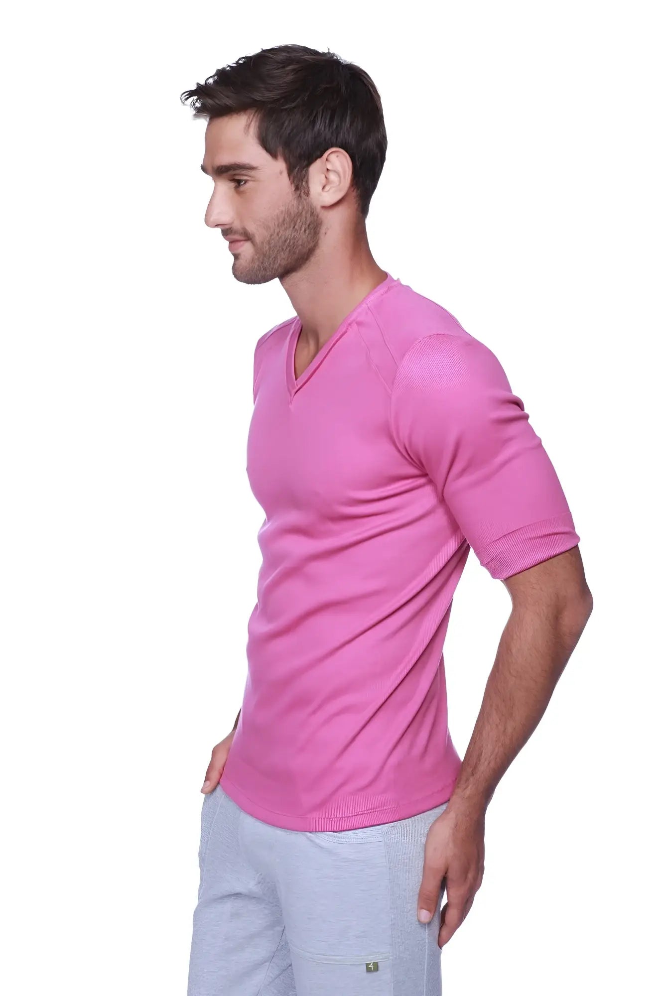 A vibrant pink hybrid v-neck t-shirt made of soft stretchy fabric with short sleeves