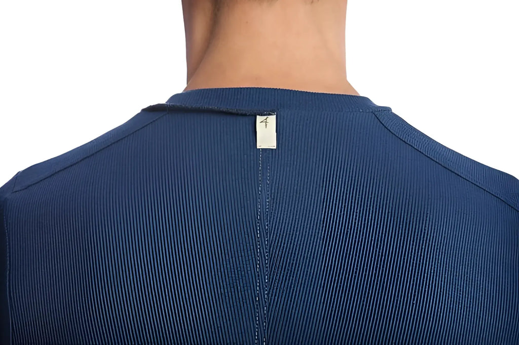Blue ribbed knit hybrid v-neck shirt in royal with a small white tag at the neckline