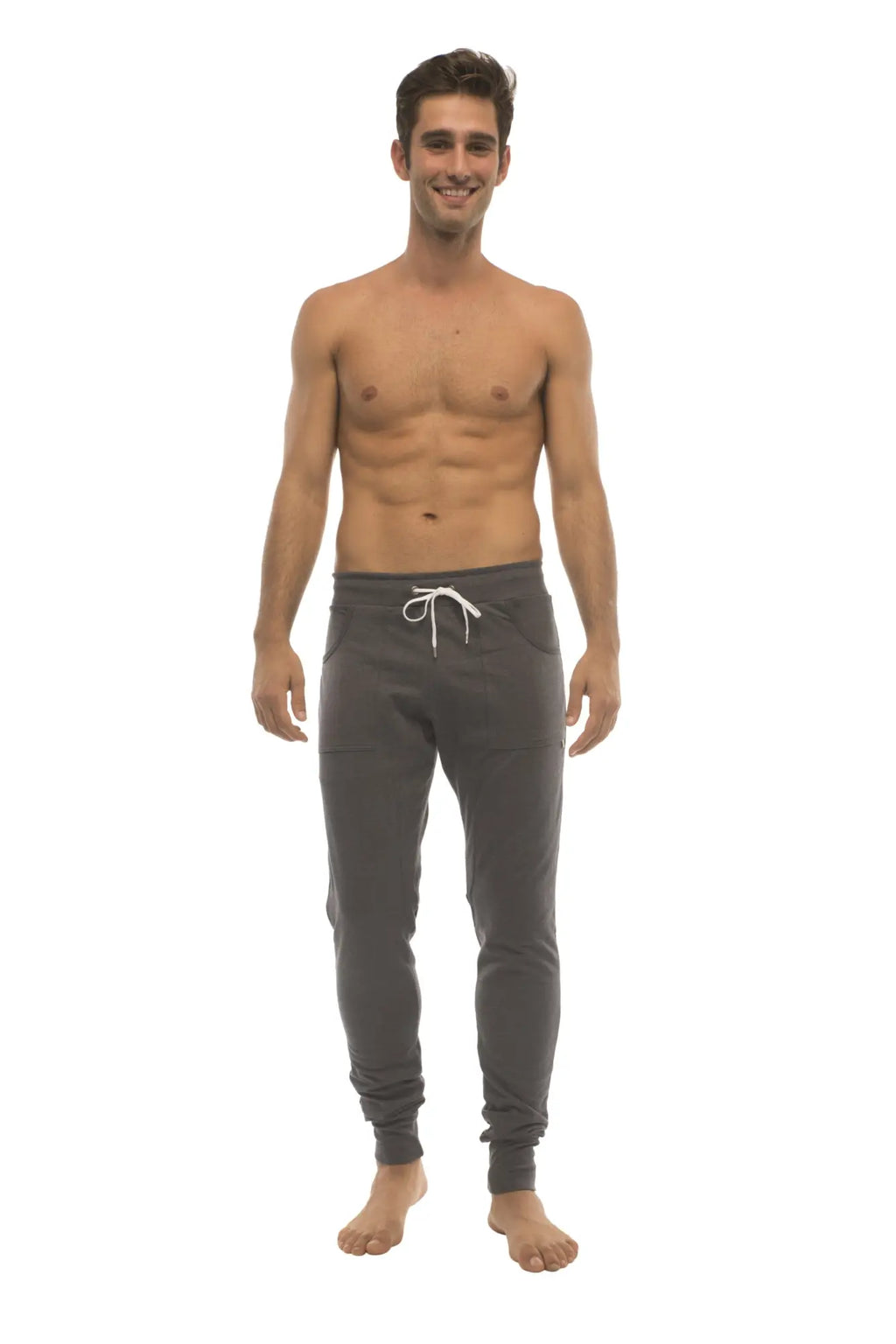 Dark gray long cuffed jogger and yoga sweatpants with white drawstring waistband and elastic cuffs
