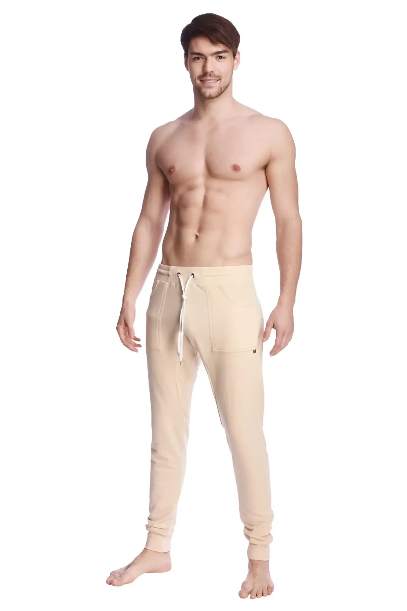 Beige long cuffed jogger and yoga sweat pants with drawstring waistband and side pockets for casual wear