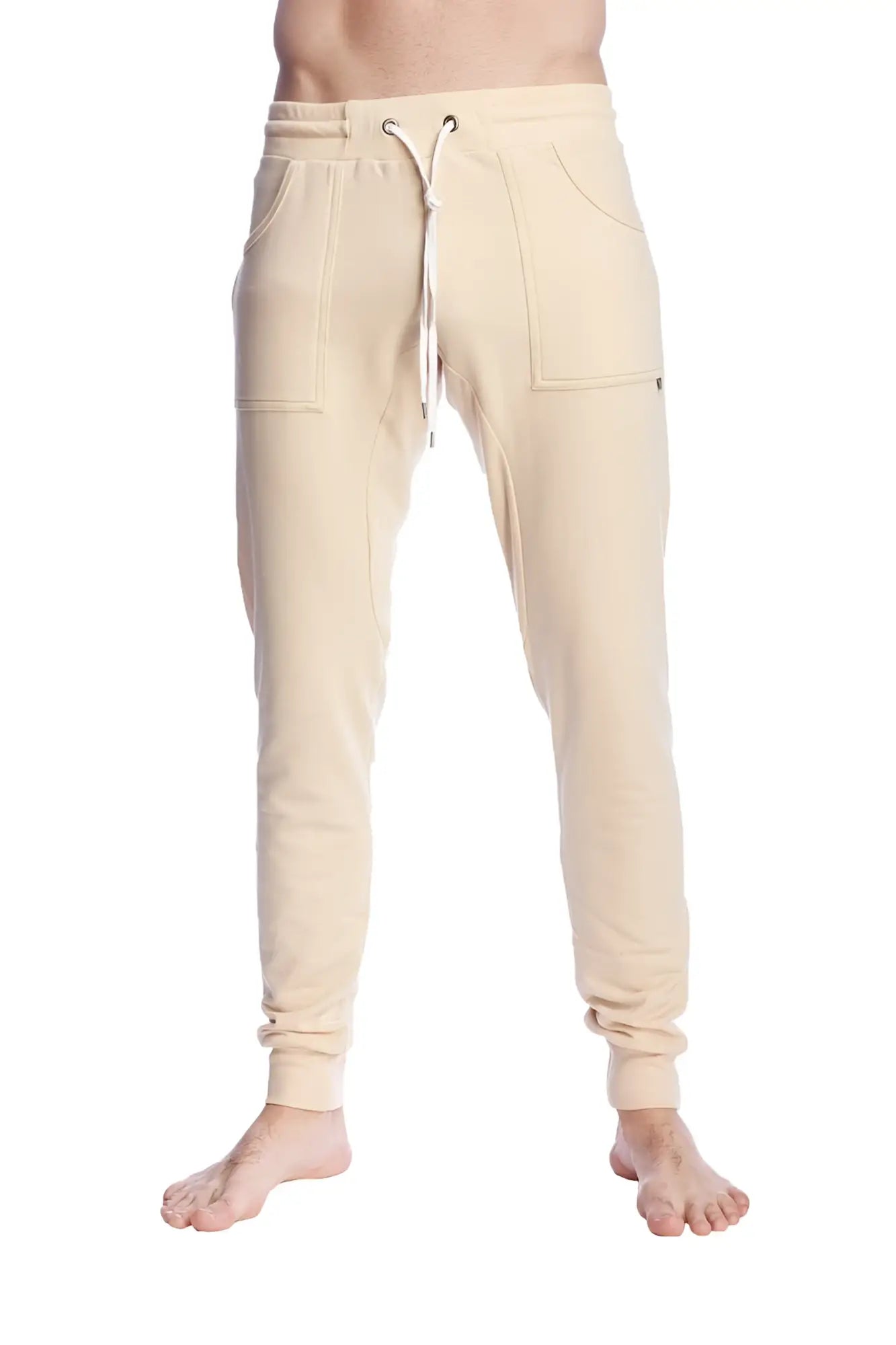 Long cuffed sand beige jogger and yoga sweat pants with drawstring waist and side pockets in cream color