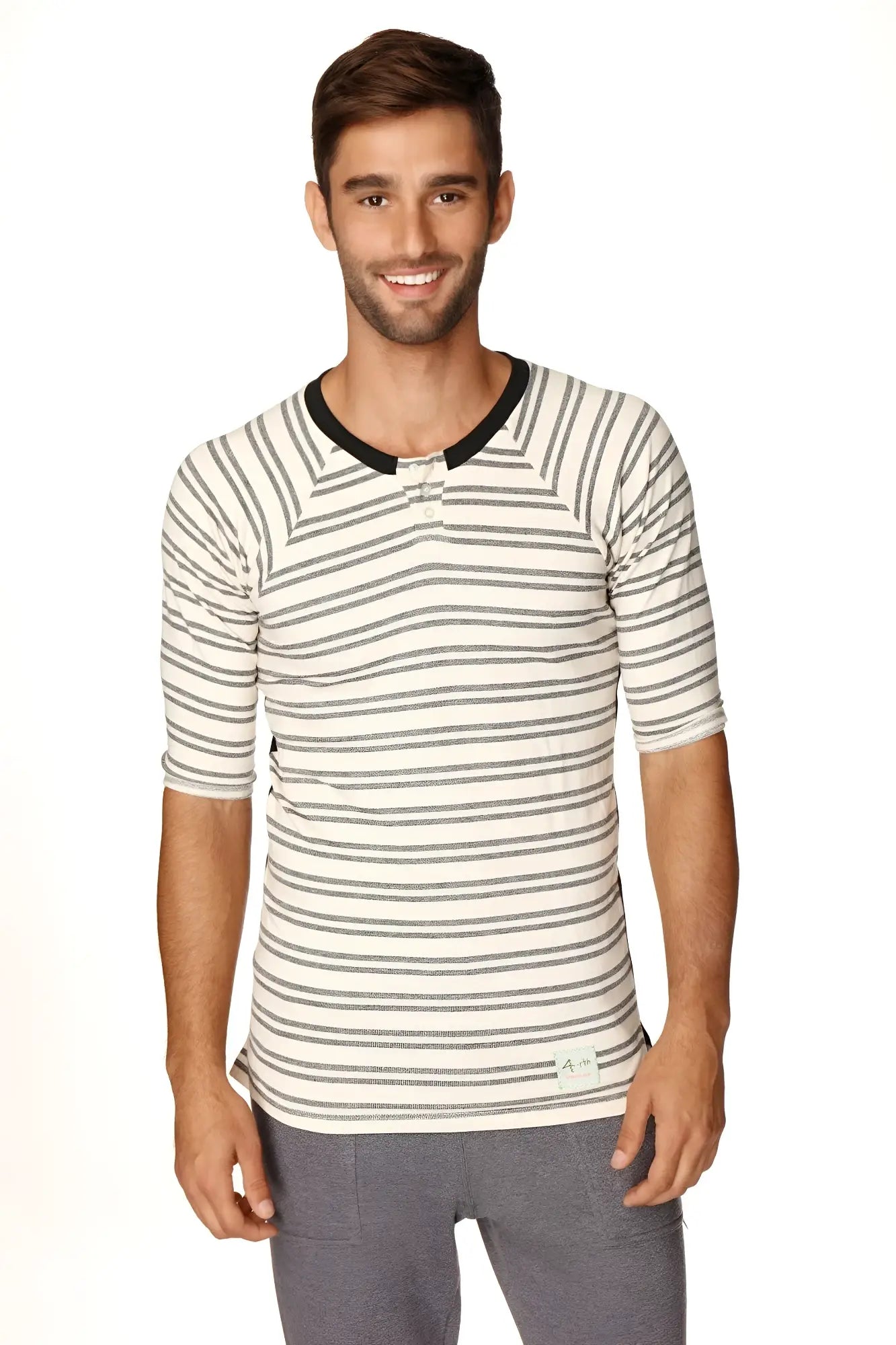 A man wearing a 4-rth mens vintage-stripe henley tee in cream and gray French terry loop with black ribbed collar