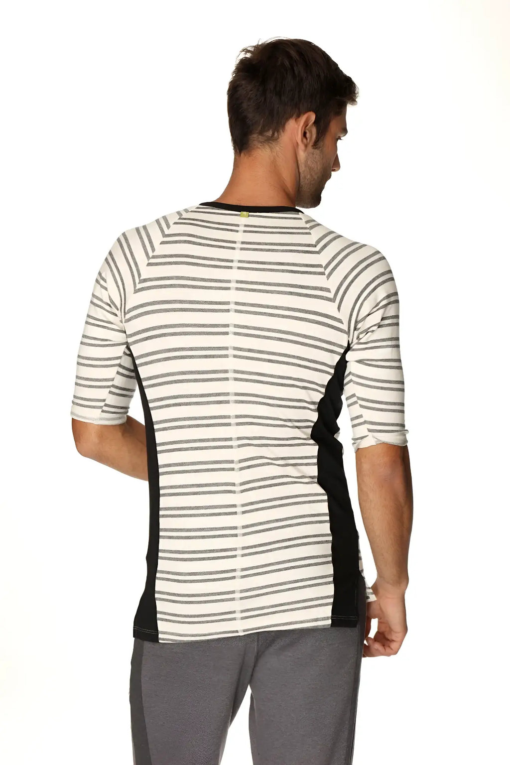 A men’s short-sleeved 4-rth vintage-stripe henley tee in dark grey double stripe french terry loop with black panels and green button