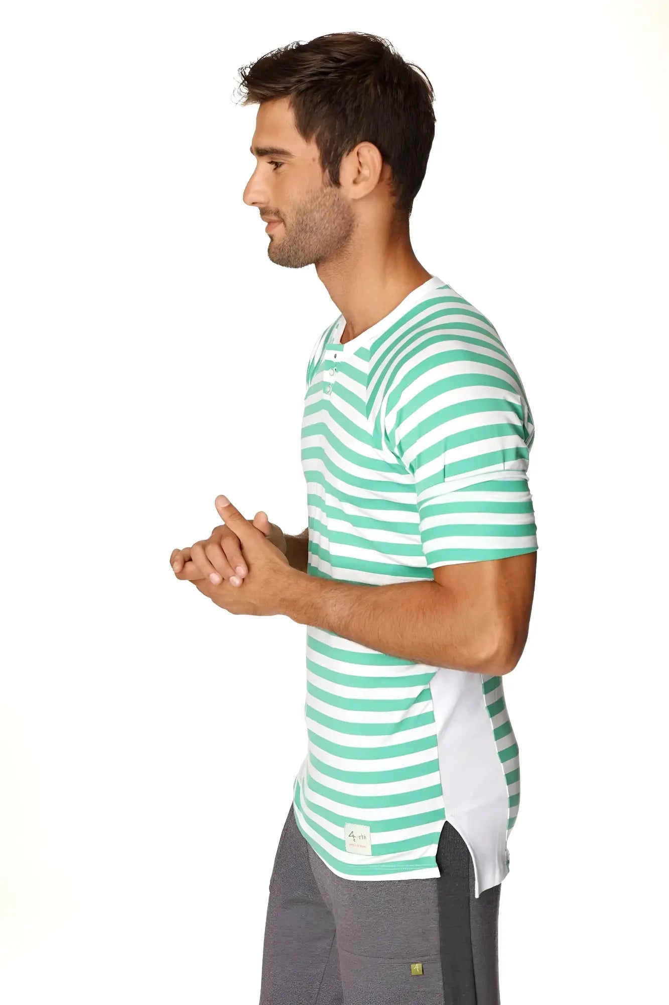 A man wearing a teal and white striped short-sleeved nautical raglan resort henley tee with crew neck