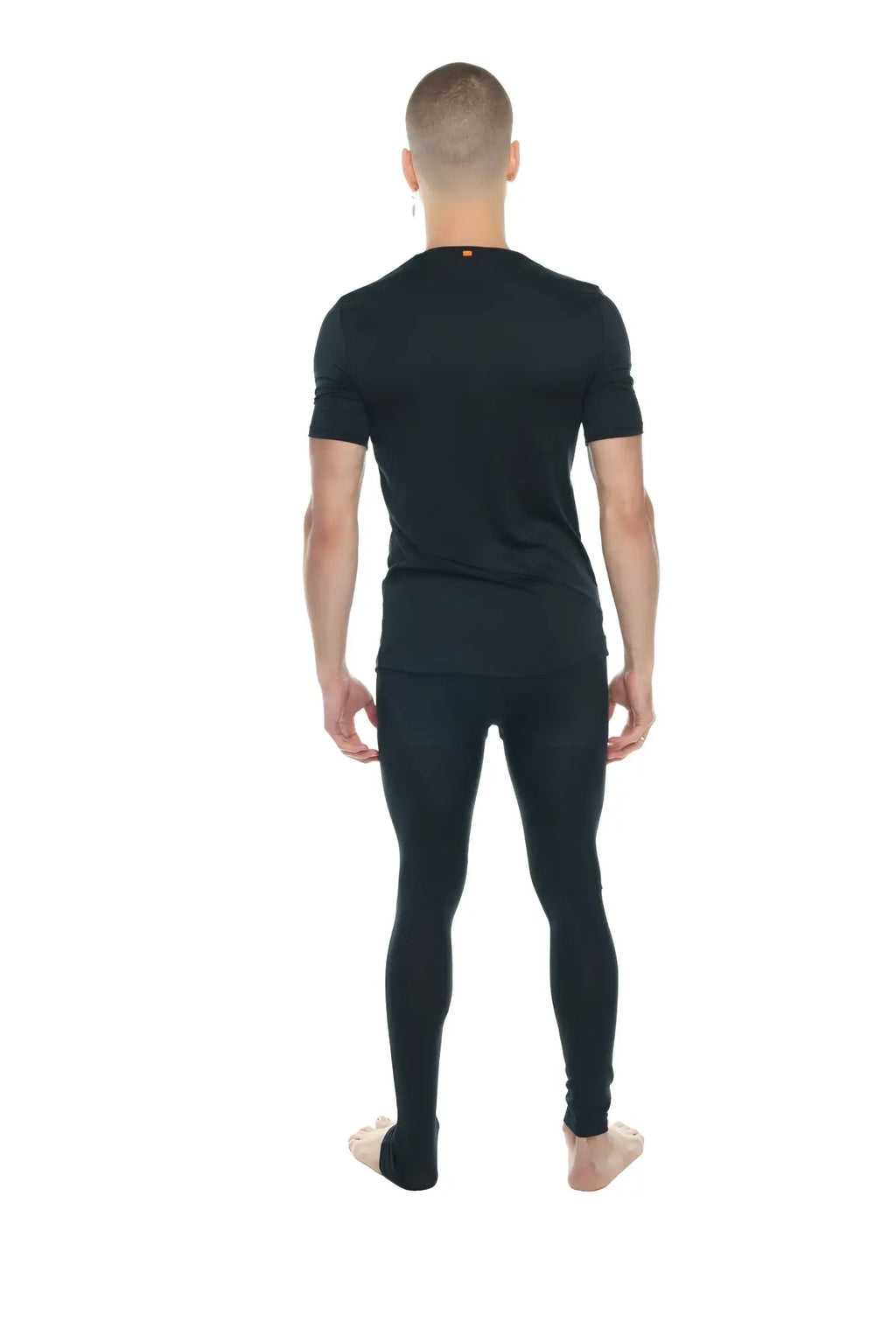 Black carbon perfect pocket crew neck tee paired with black seamless form fitting short sleeve and full length leggings set