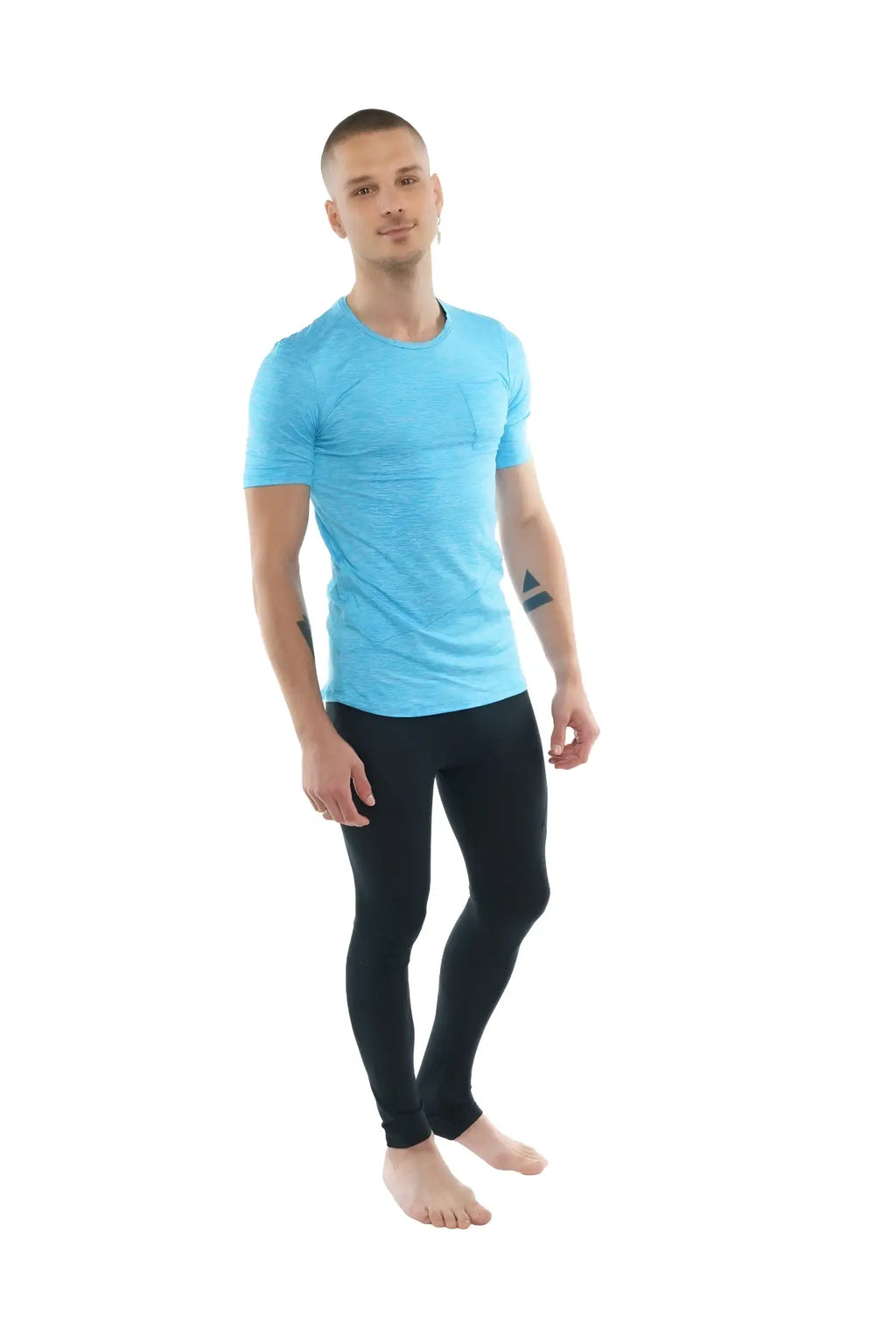 A man wearing a coral heather perfect pocket crew-neck tee in light blue and black athletic leggings