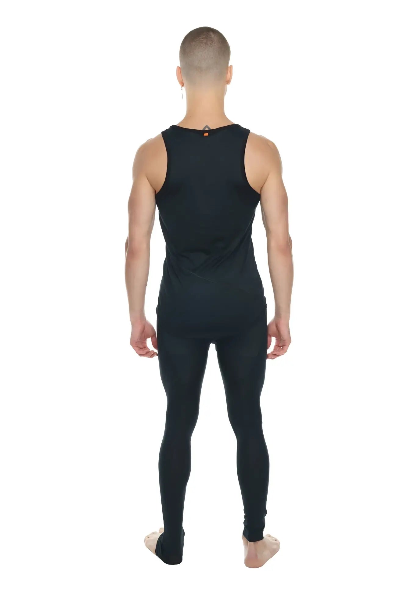 The perfect tank black carbon is a fitted black sleeveless athletic top with a small orange accent at the neckline