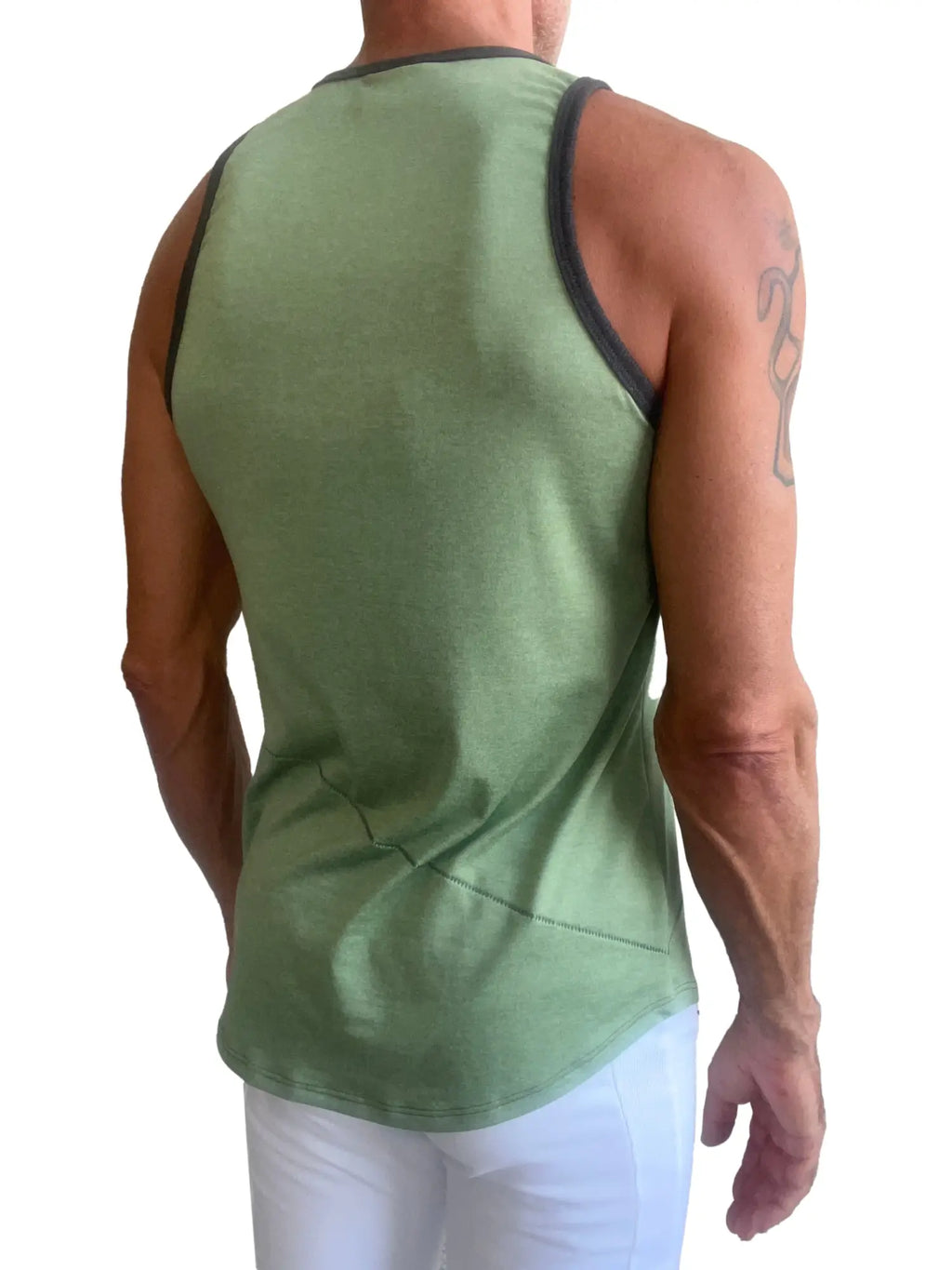 A men’s perfect tank in sage green with black trim along the neckline and armholes for casual wear