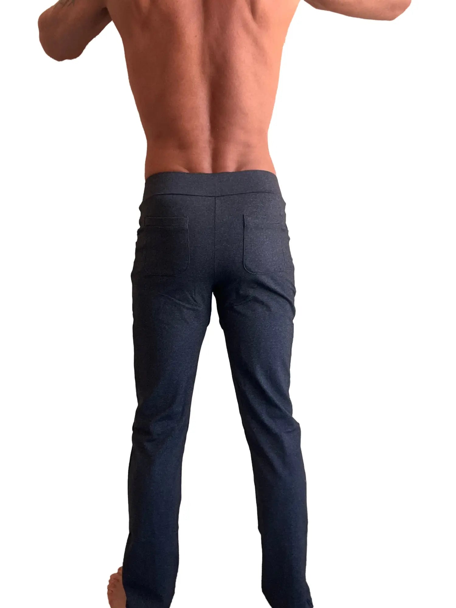 Dark blue slim-fit performance tactical urban dress pant with subtle textured fabric and two rear pockets shown from back