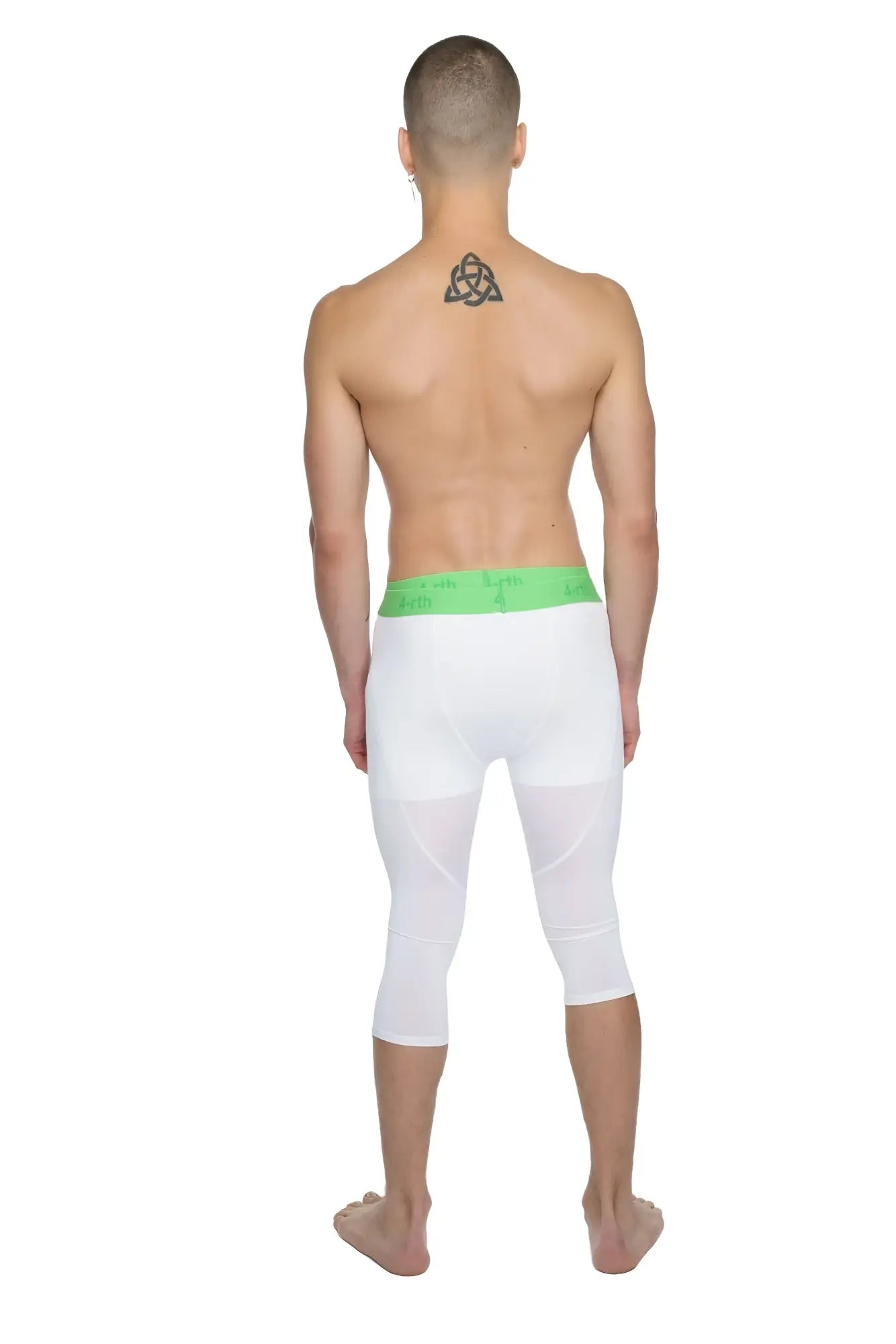 White capri-length performance yoga leggings with bright green elastic waistband designed for active wear