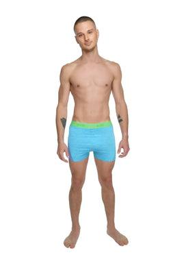 Light blue boxer briefs with bright green elastic waistband shown with performance yoga leggings short coral heather product