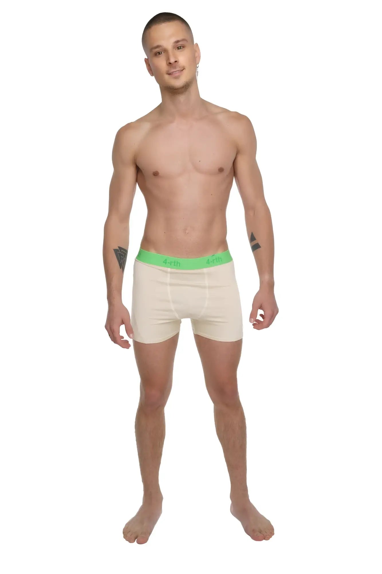 Cream-colored boxer briefs with bright green elastic waistband featuring brand logo in performance yoga leggings short sand beige