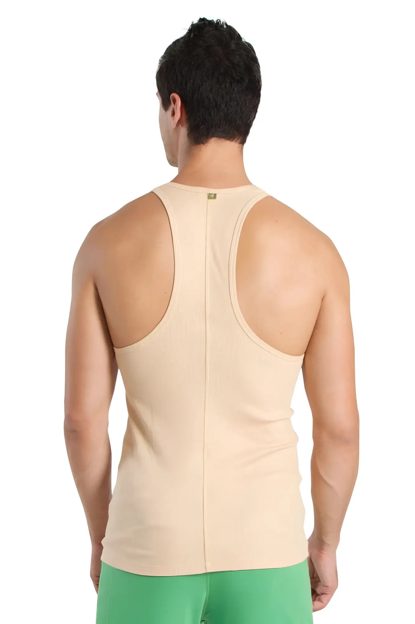Beige racer-back yoga tank with central seam and subtle brand tag at neckline for activewear use
