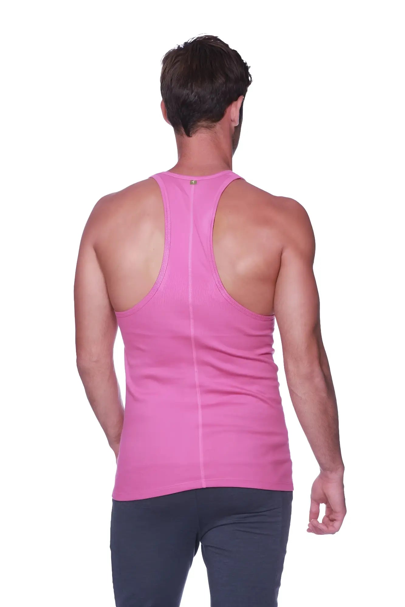 A vibrant berry pink form-fitting racerback yoga tank top with a subtle vertical seam down the center