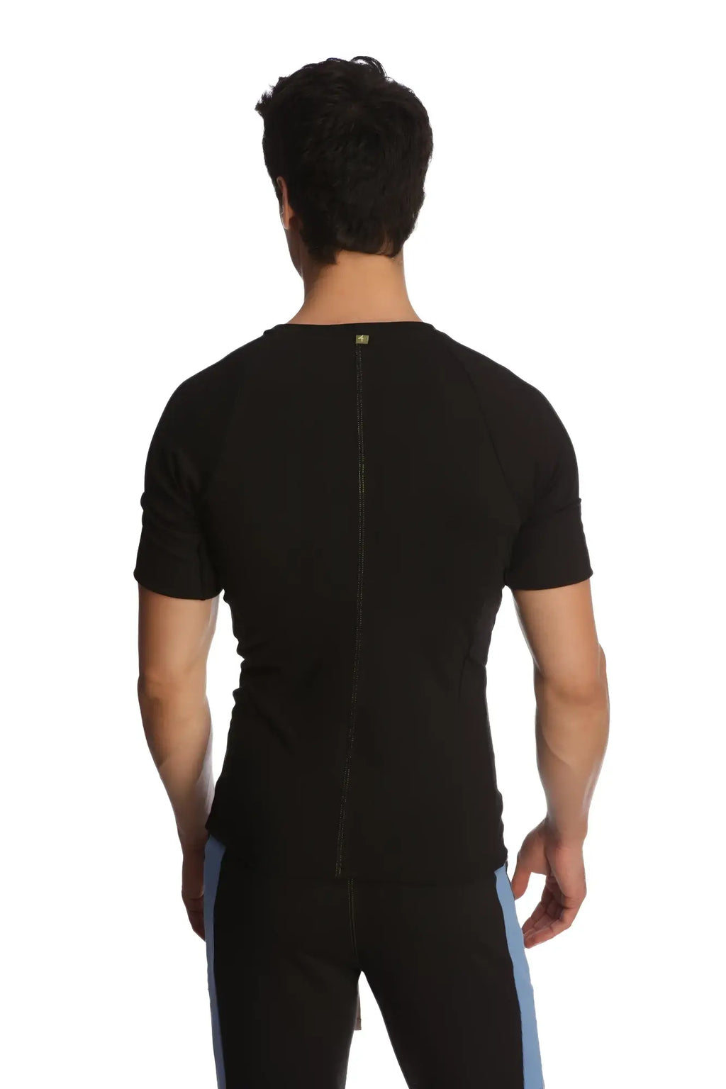 Back view of black raglan virtual crew neck athletic shirt with short sleeves and central zipper on the back