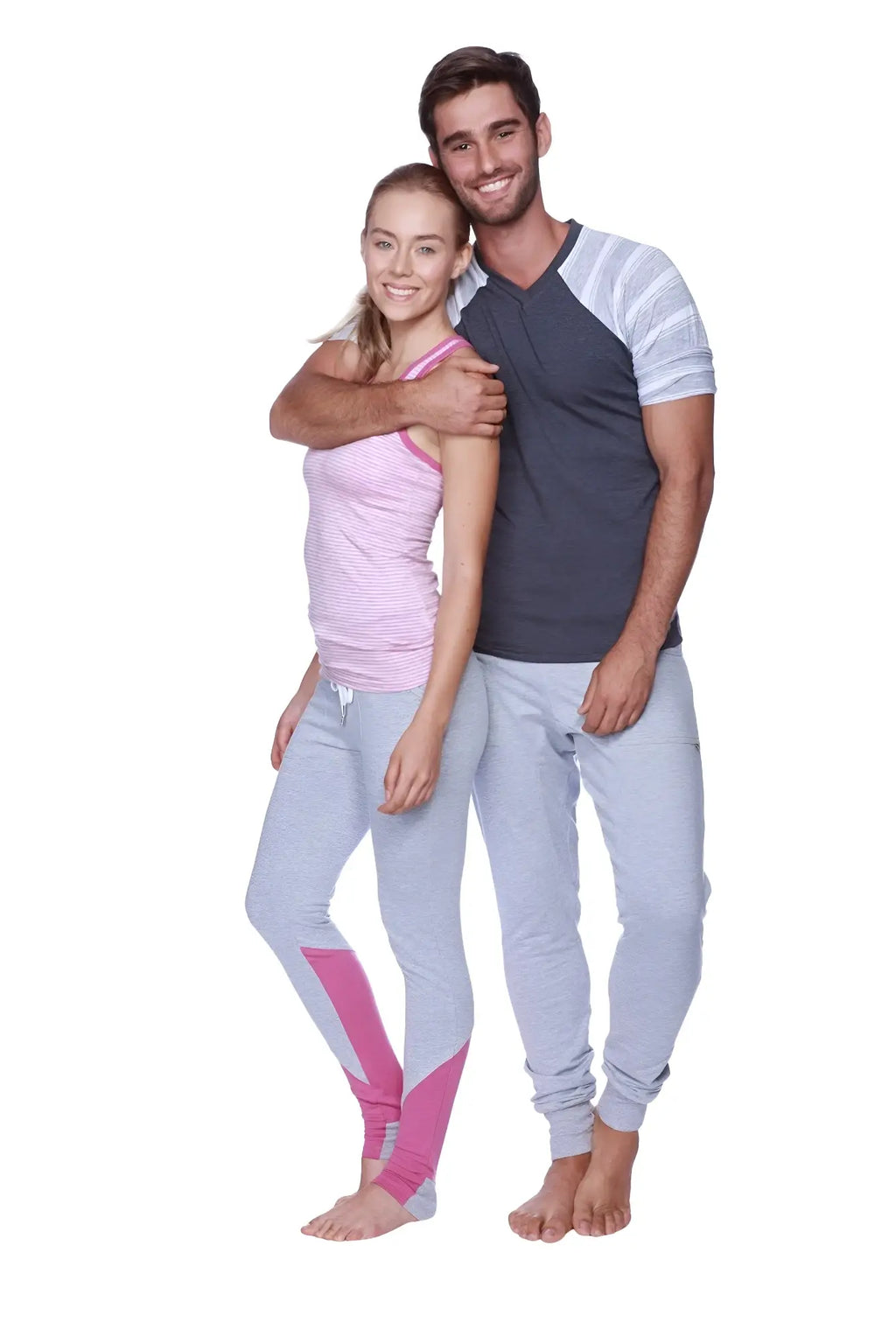A pair of light gray athletic leggings with vibrant pink panels along outer thighs and lower legs for active wear