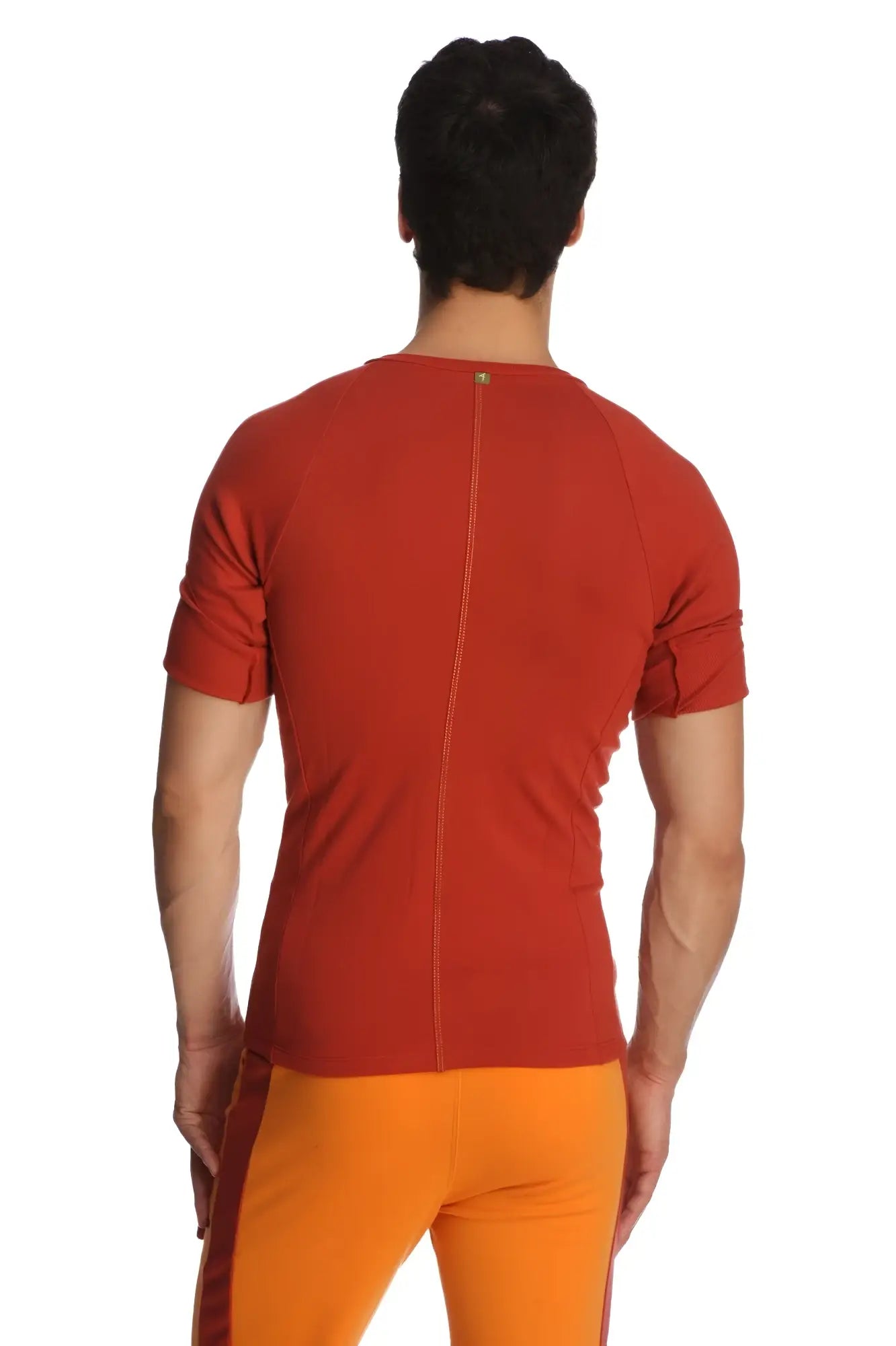 Back of a fitted short-sleeved orange raglan virtual crew neck shirt with central zipper and subtle seam detailing