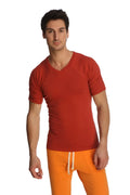 A man wearing a vibrant red short-sleeved v-neck raglan virtual crew neck t-shirt with subtle seam detailing
