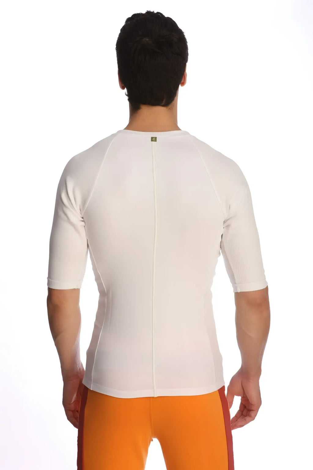 Back view of white raglan virtual crew neck short-sleeved athletic shirt with central zipper and subtle seam detailing