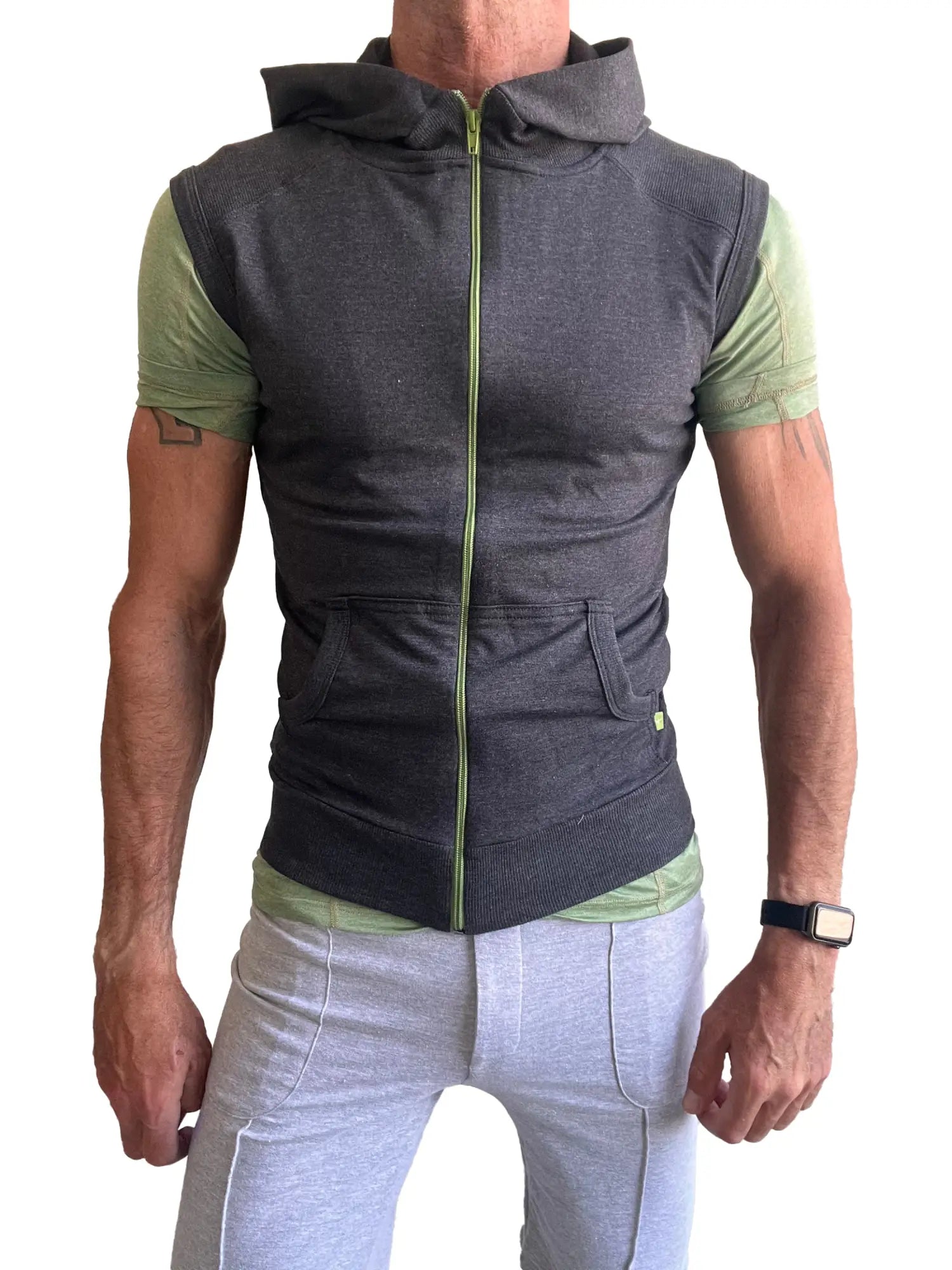 Sleeveless yoga hoodie charcoal gray zip-up vest with lime green zipper and accents worn over matching short sleeve shirt