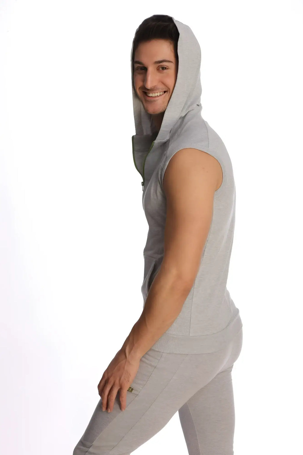 A light gray sleeveless yoga hoodie with a hood and front zipper made of soft fabric for comfortable workouts