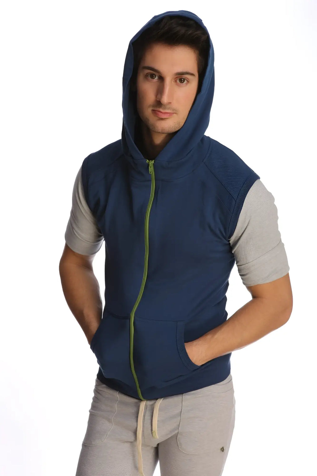Navy blue sleeveless yoga hoodie with lime green zipper and gray short sleeves designed for active wear