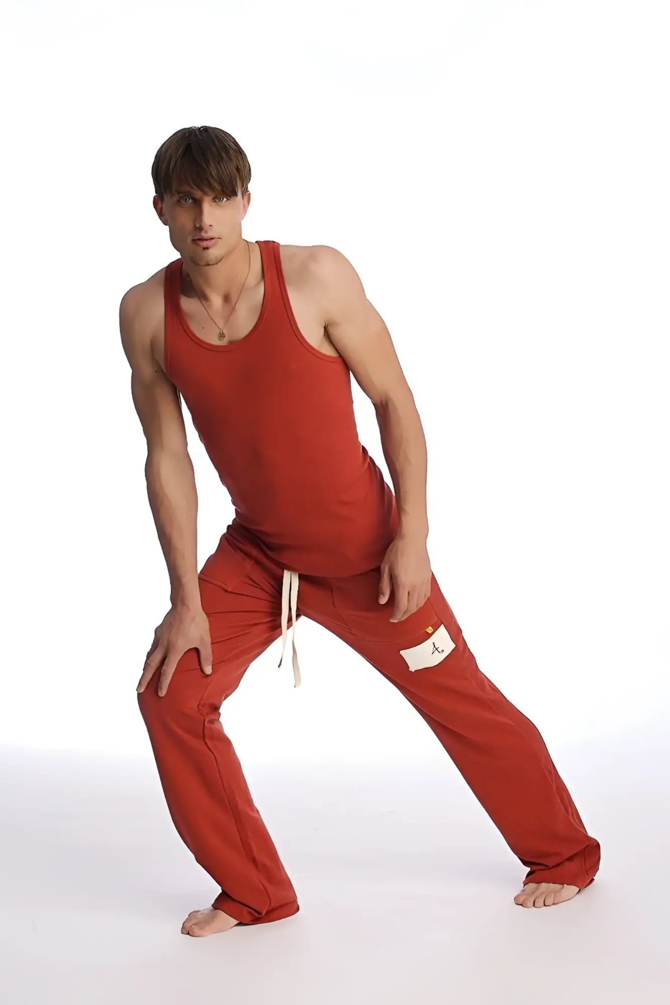 Red cotton sustain tank in cinnabar with a simple fitted design and thin straps for casual wear