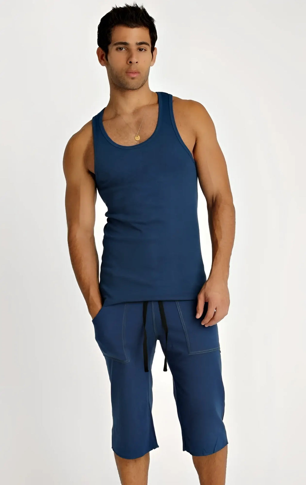Men’s navy blue sleeveless Sustain Tank with rounded neckline and matching capri-length shorts for active wear